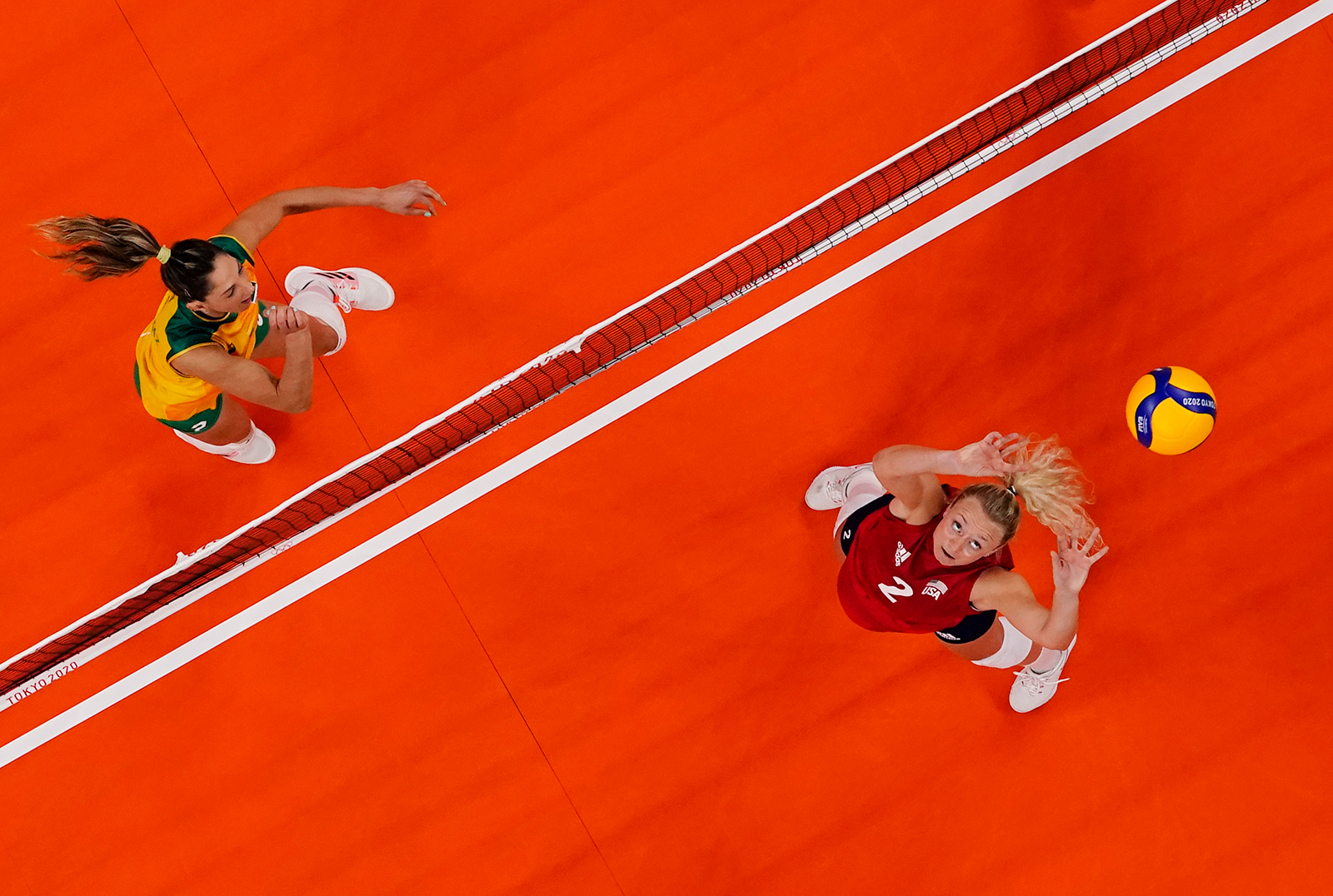 United States' Jordyn Poulter, right, sets the ball during a gold medal volleyball match against Brazil on Sunday.