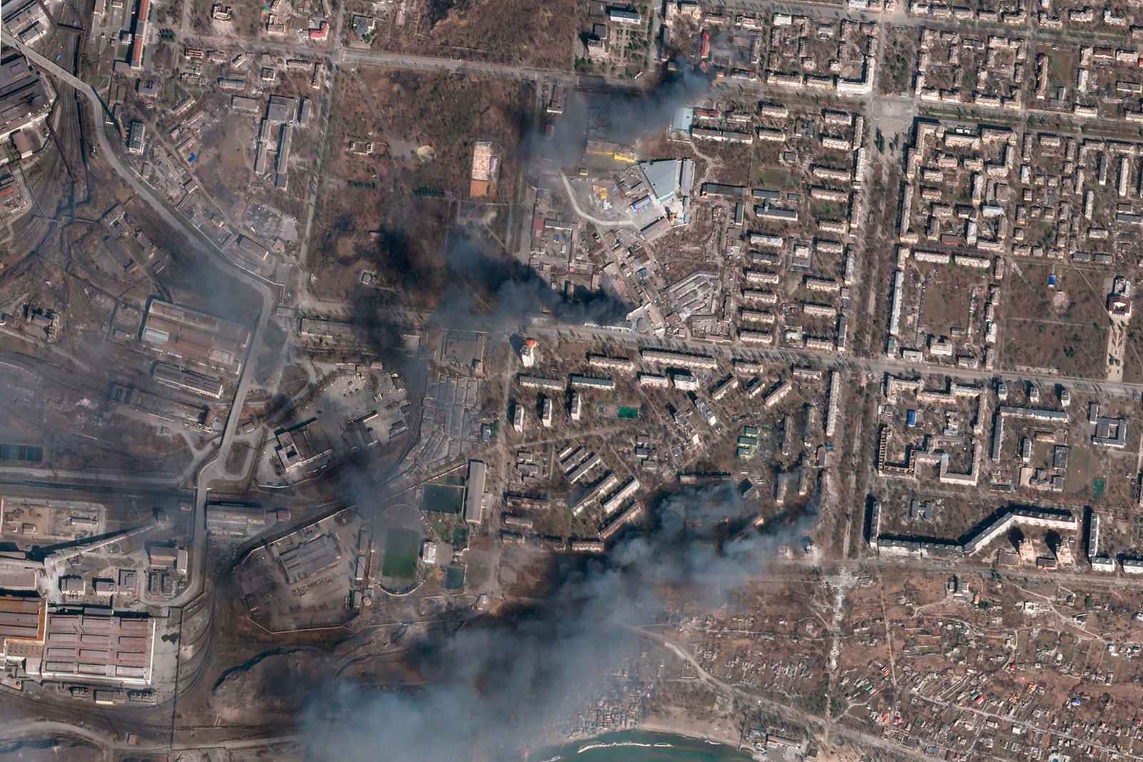 Multiple buildings burn amid Russian strikes on Mariupol, Ukraine, on March 20.