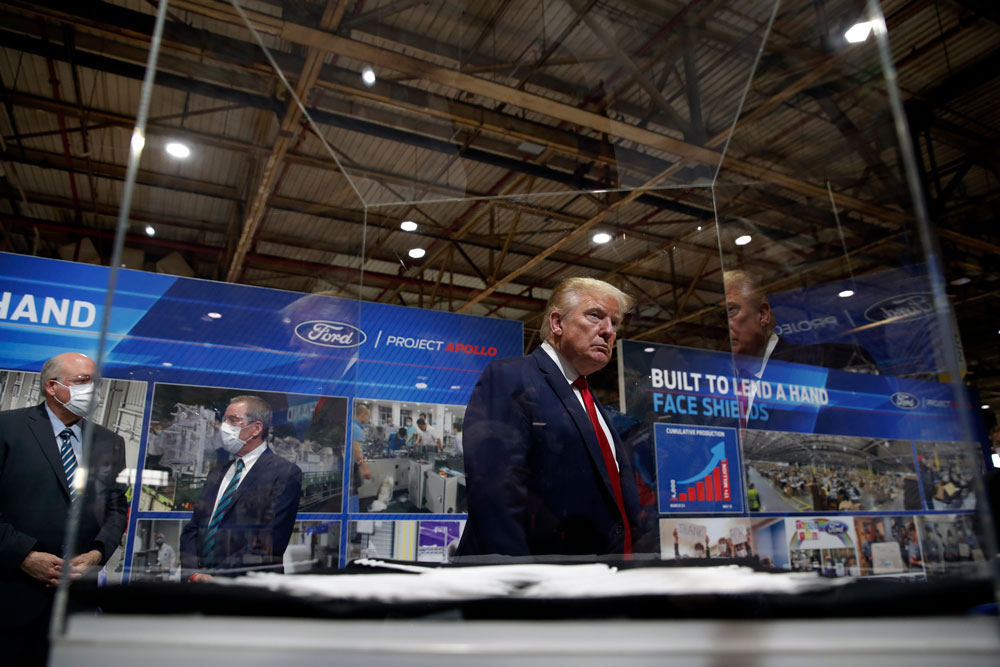President Donald Trump tours Ford's Rawsonville Components Plant that has been converted to making personal protection and medical equipment on Thursday, May 21, in Ypsilanti, Michigan.