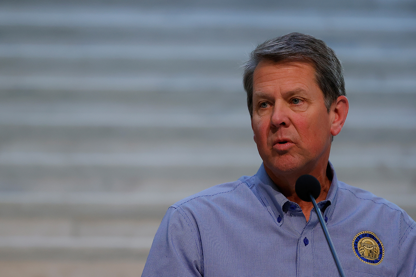 Georgia Gov. Brian Kemp speaks to the media during a press conference at the Georgia State Capitol on April 27, in Atlanta.