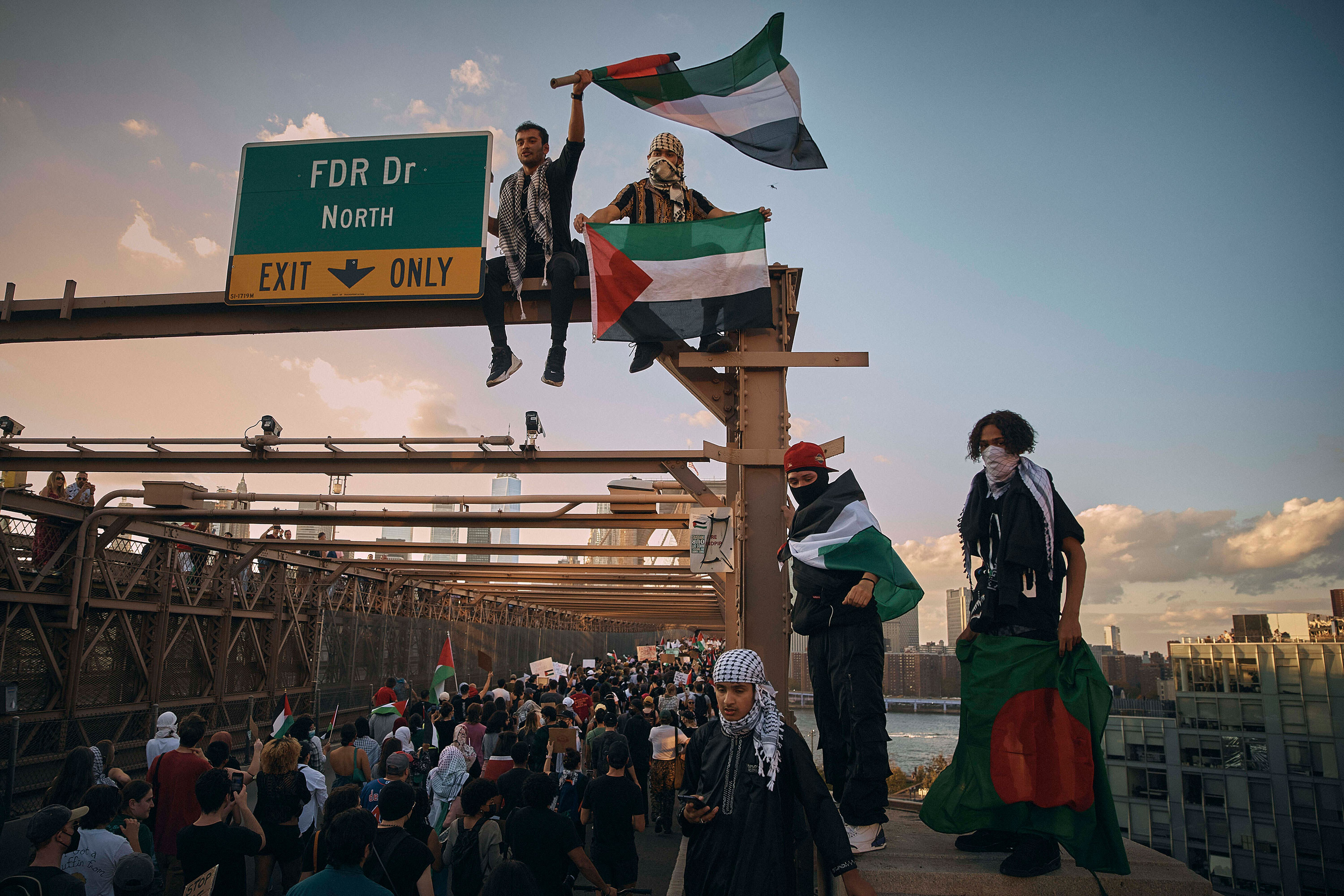 People shout slogans as they cross Brooklyn Bridge during a pro-Palestinian demonstration in New York on October 28. 