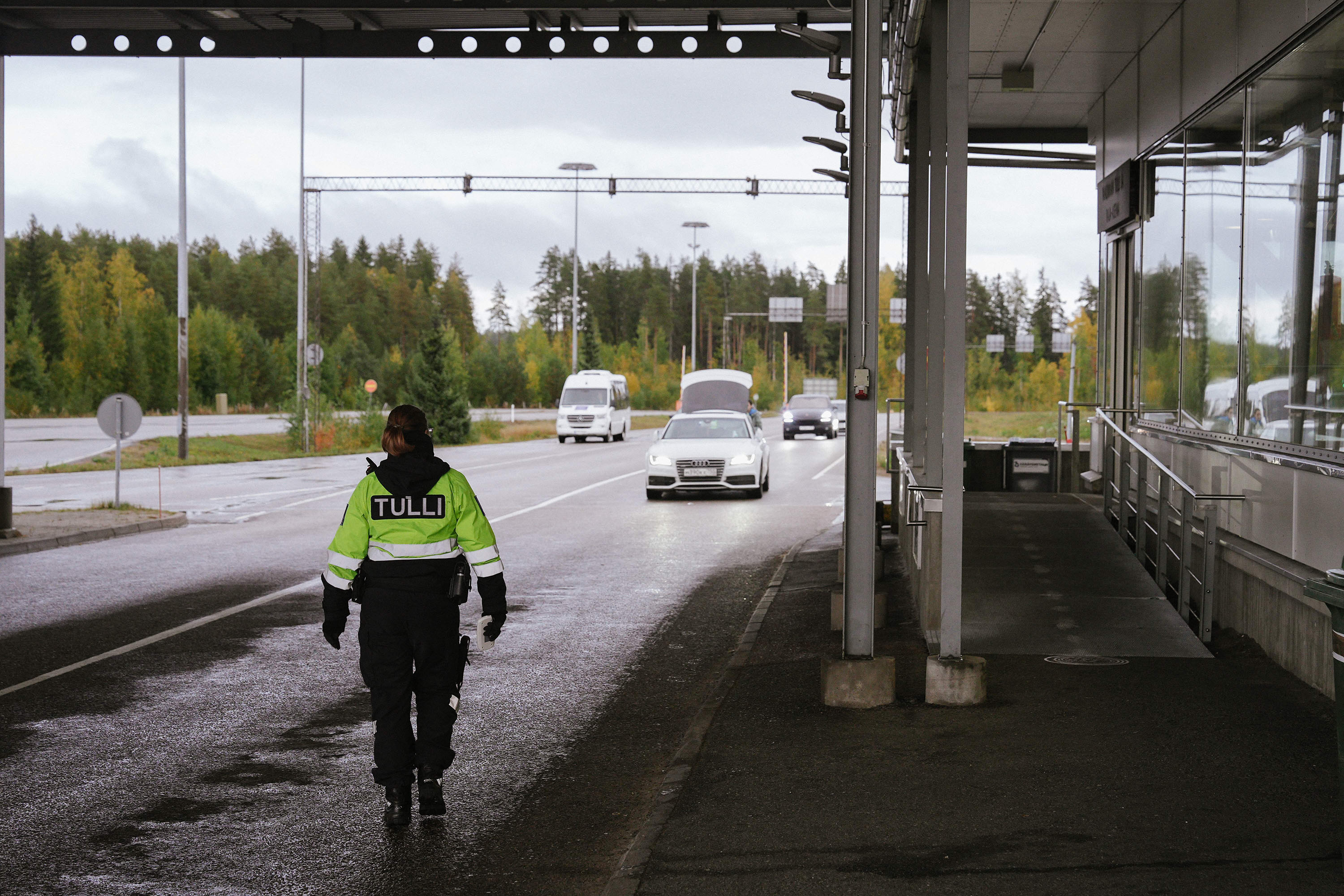 A customs official is seen in Vaalimaa, Finland, on the border with Russia, in September 2022.