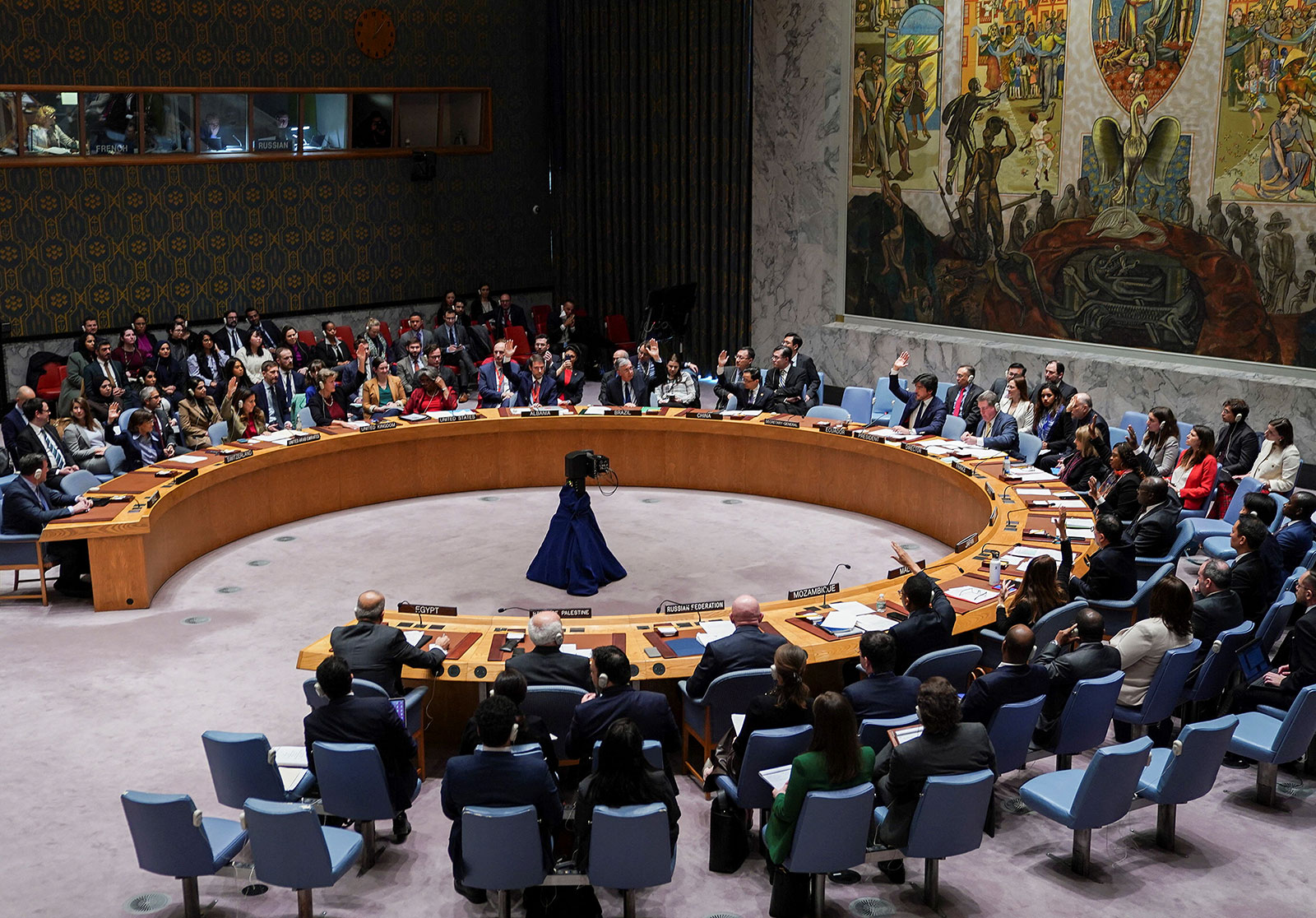 Members of the United Nations Security Council vote on a resolution calling for pauses in fighting between Israel and Hamas in order to establish humanitarian corridors throughout Gaza during a meeting at UN headquarters in New York on Friday.