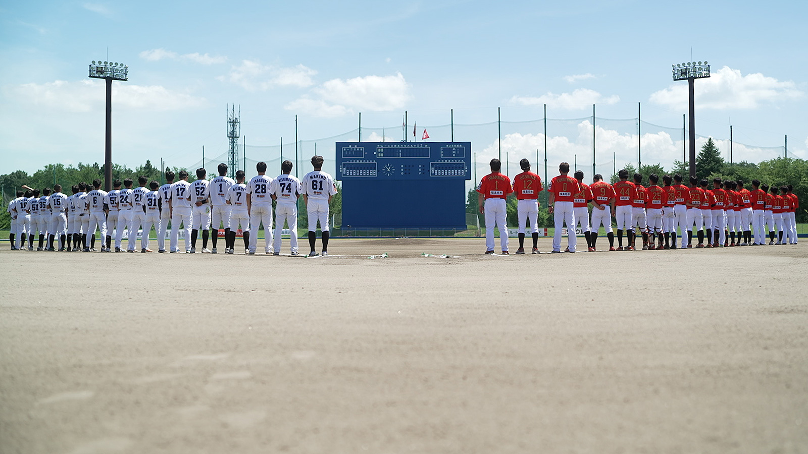 The Red Hopes Fukushima prepare to play a game against a team from Gunma at a stadium in Izumizaki village in Fukushima prefecture.