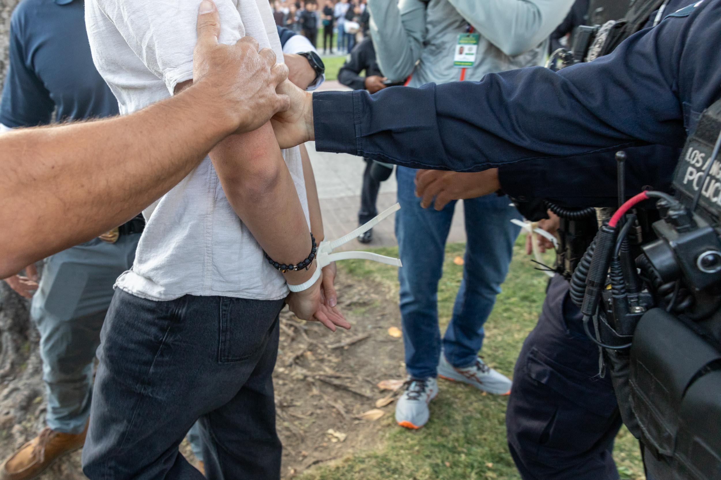 Members of law enforcement and police officers intervene during a pro-Palestinian student protest at University of Southern California in Los Angeles, California, on April 24.