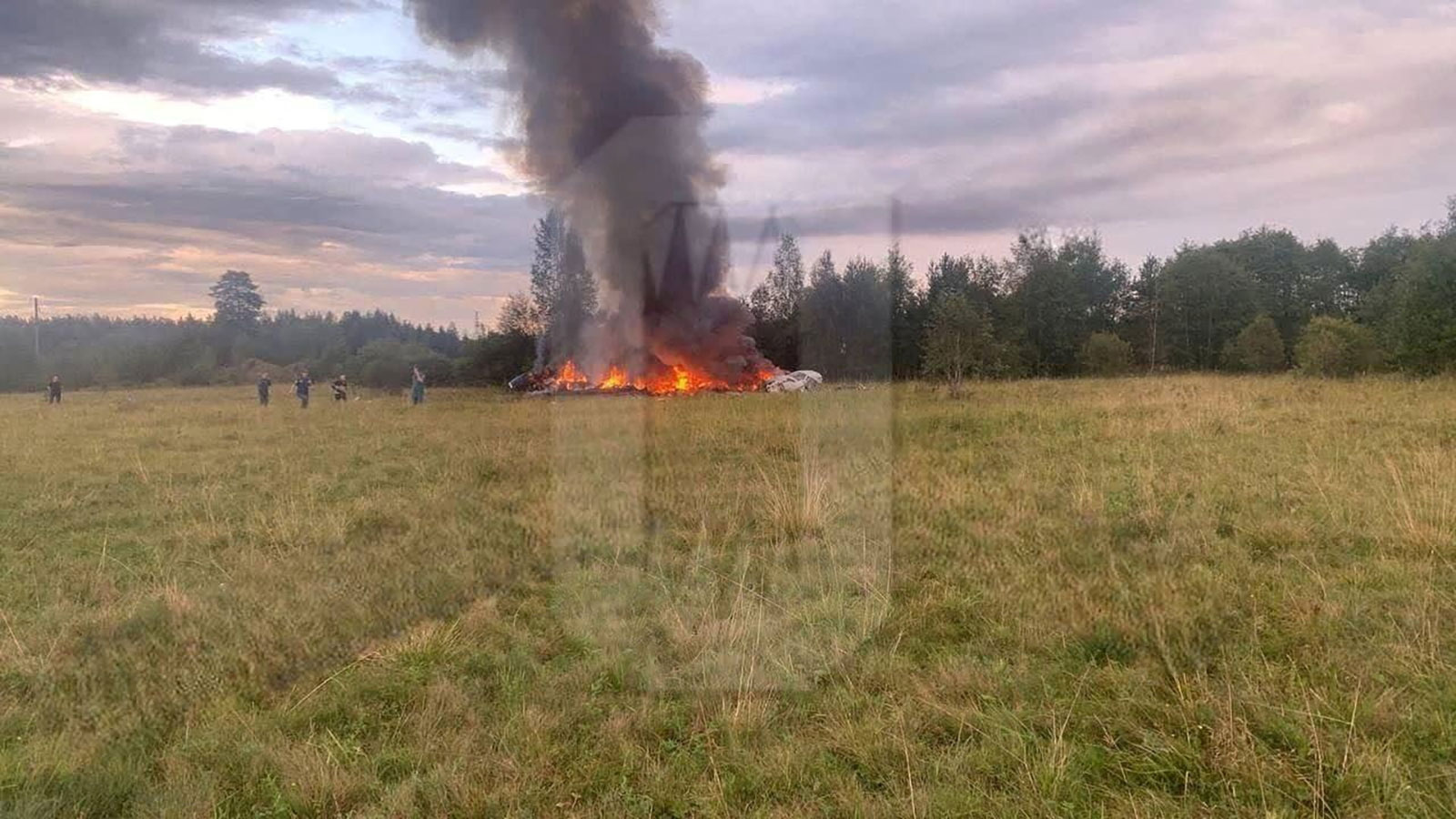 A view shows plane wreckage on fire following an air accident in Tver region, Russia, on August 23. Yevgeny Prigozhin, chief of Russian private mercenary group Wagner, was reportedly listed as a passenger on the private jet.