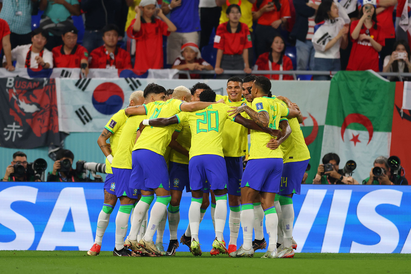 Brazil players dance in celebration after scoring a goal in their round of 16 match against South Korea.