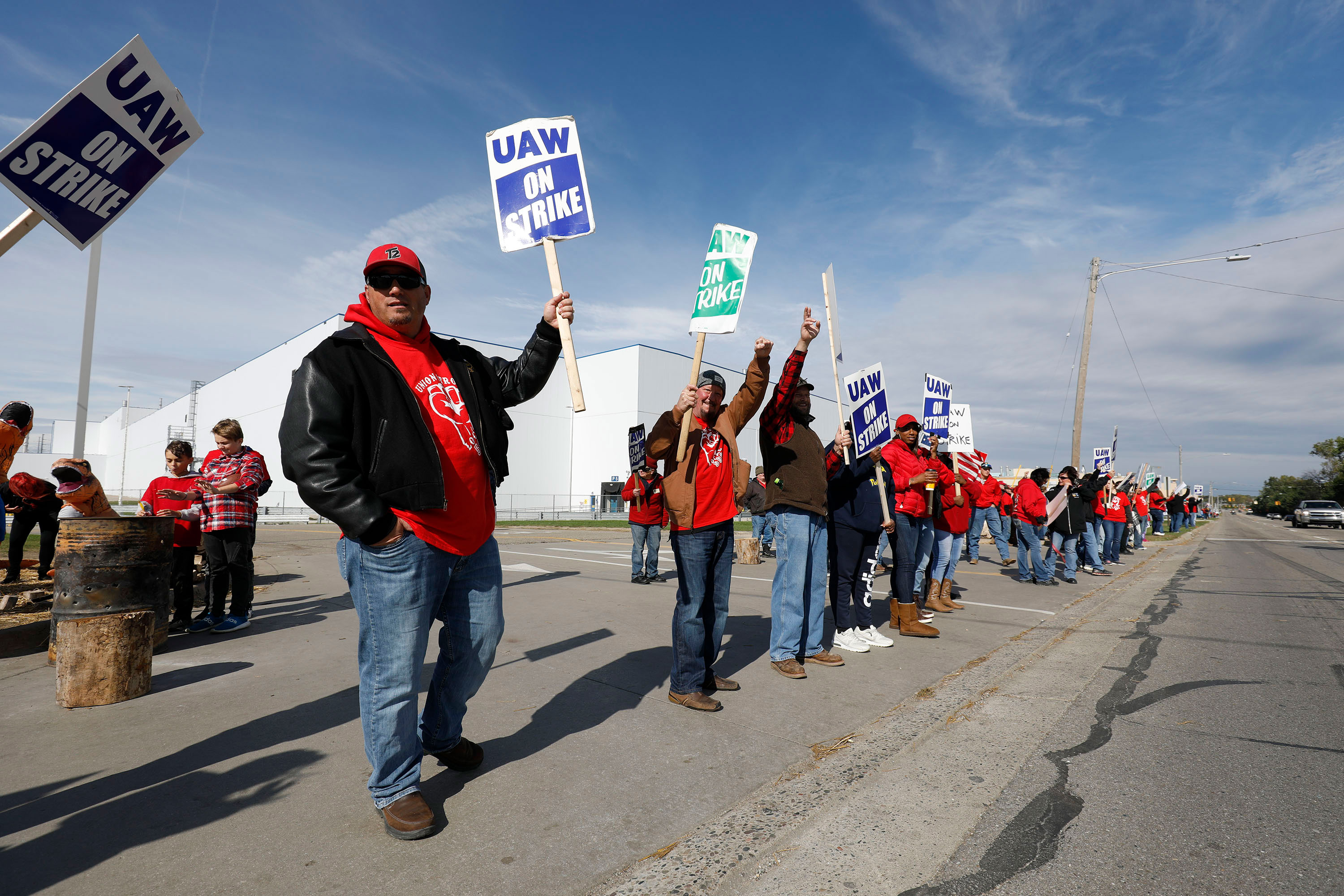 United Auto Workers union members and their families picket at the General Motors Flint Assembly plant on October 13, 2019, in Flint, Michigan. 