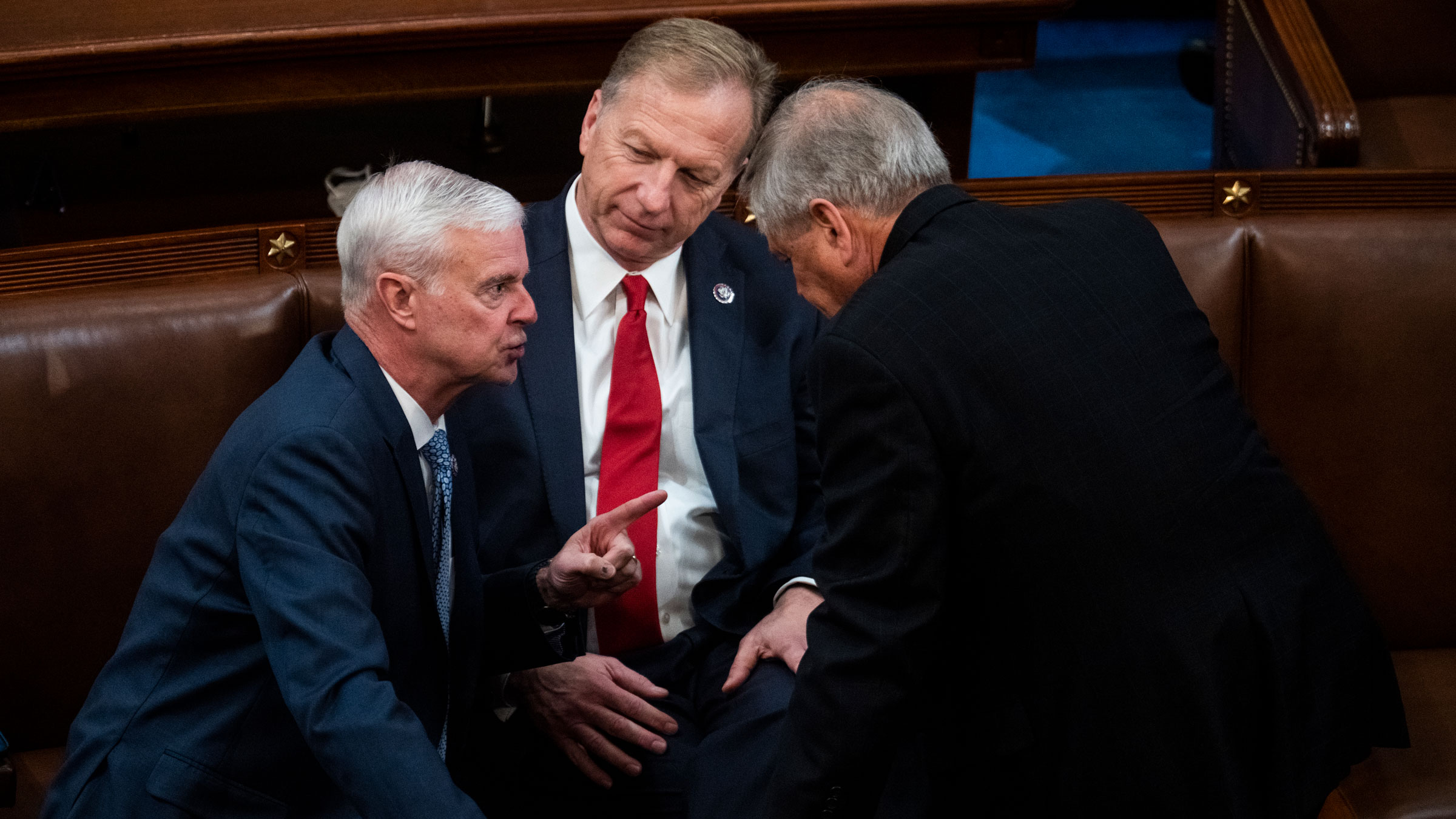 From left, Republican Reps. Steve Womack, Kevin Hern and Ralph Norman speak on the House floor before a vote on Wednesday.