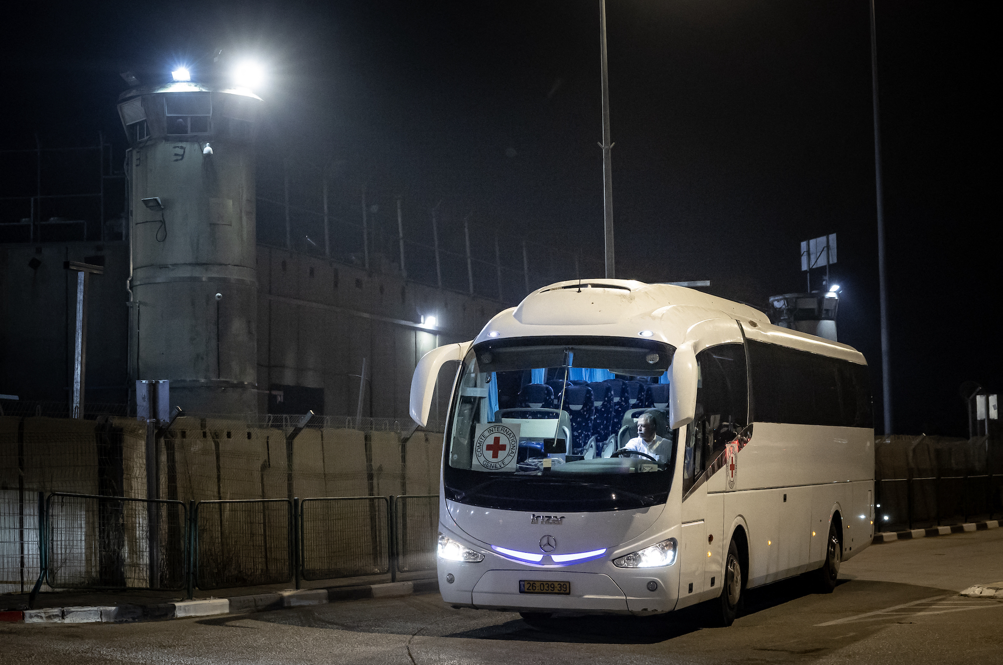 A Red Cross bus drives outside Ofer military prison in the occupied West Bank on Thursday.