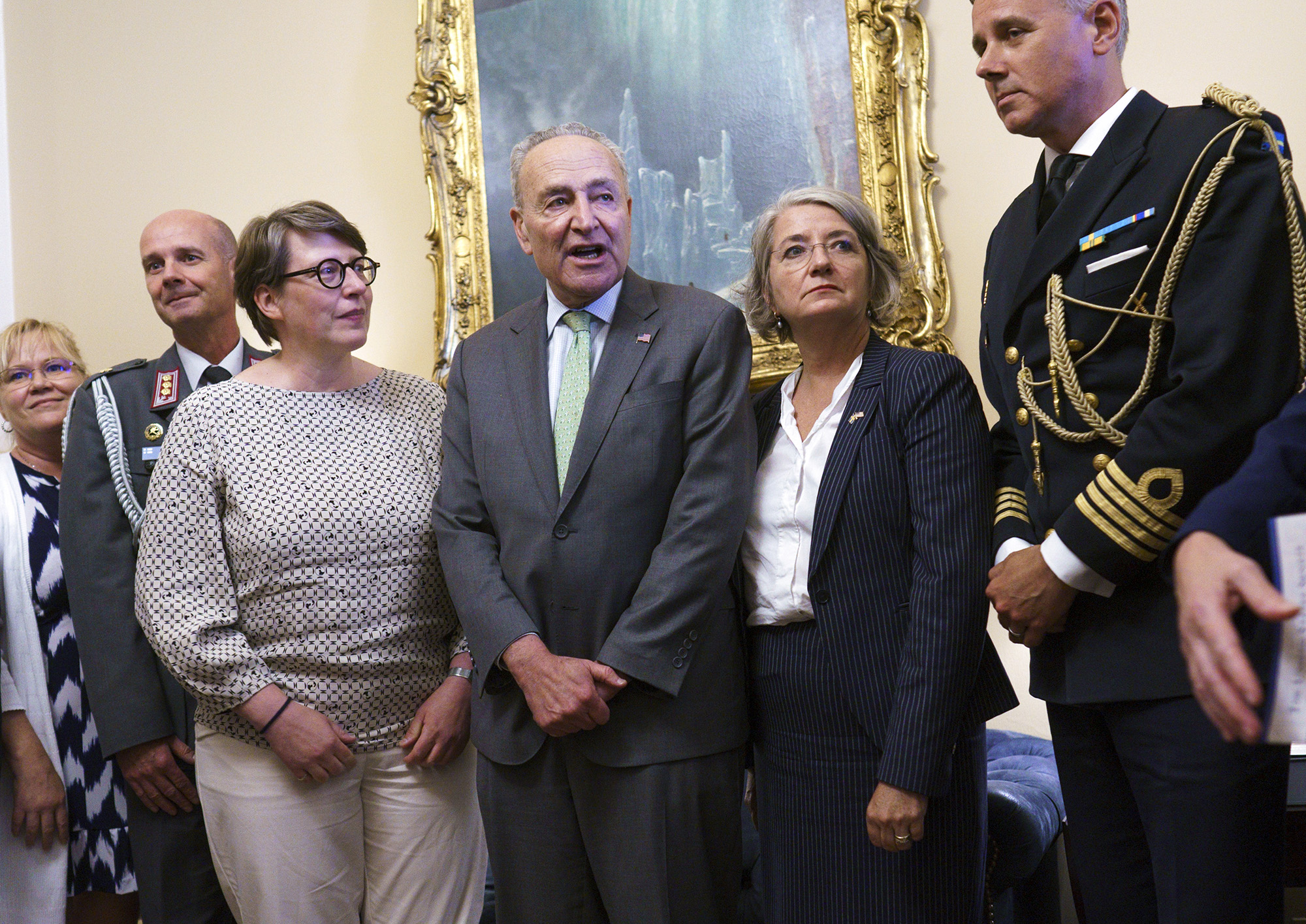 Senate Majority Leader Chuck Schumer, D-N.Y., flanked by Paivi Nevala, minister counselor of the Finnish Embassy, left, and Karin Olofsdotter, Sweden's ambassador to the US, before the Senate vote at the Capitol on Wednesday, Aug. 3.