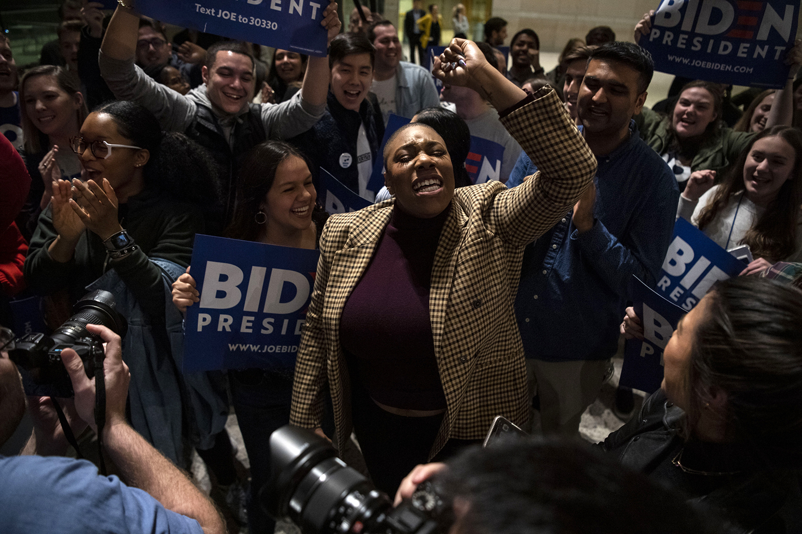 In this March 10, 2020 file photo, Symone Sanders, senior campaign advisor, dances and sings after former Vice President Joe Biden spoke about his victories and party unity at the National Constitution Center in Philadelphia.