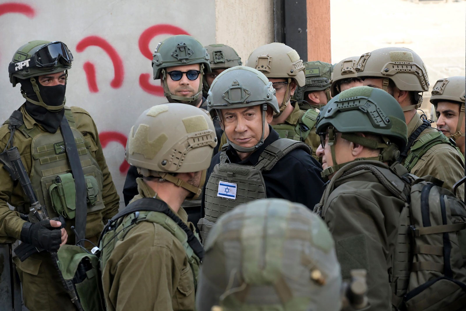 Israeli Prime Minister Benjamin Netanyahu, center, receives a security briefing with commanders and soldiers in the Gaza Strip on Monday.