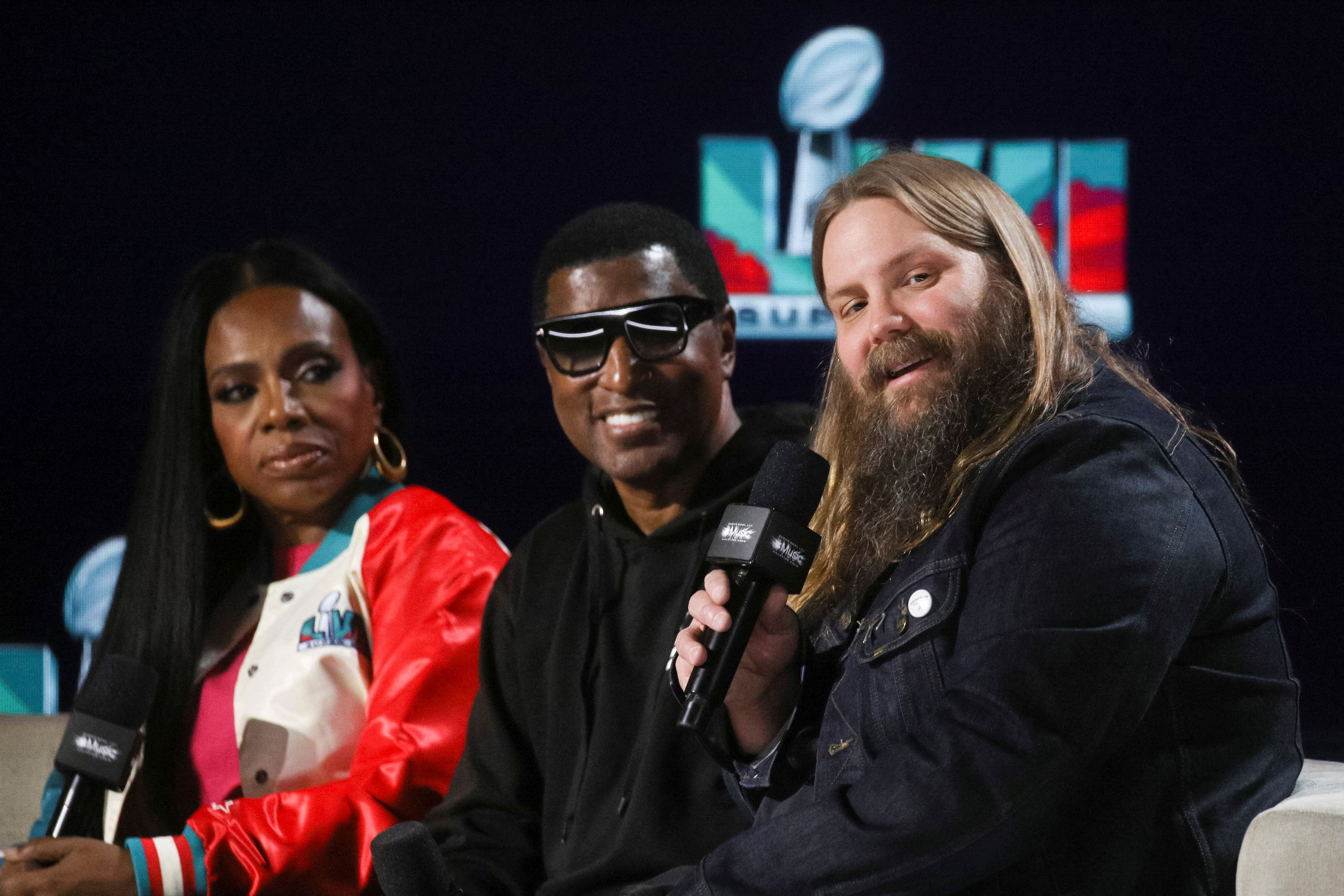 Left to right: Sheryl Lee Ralph, Babyface and Chris Stapleton answer questions at a news conference in Phoenix on Thursday.