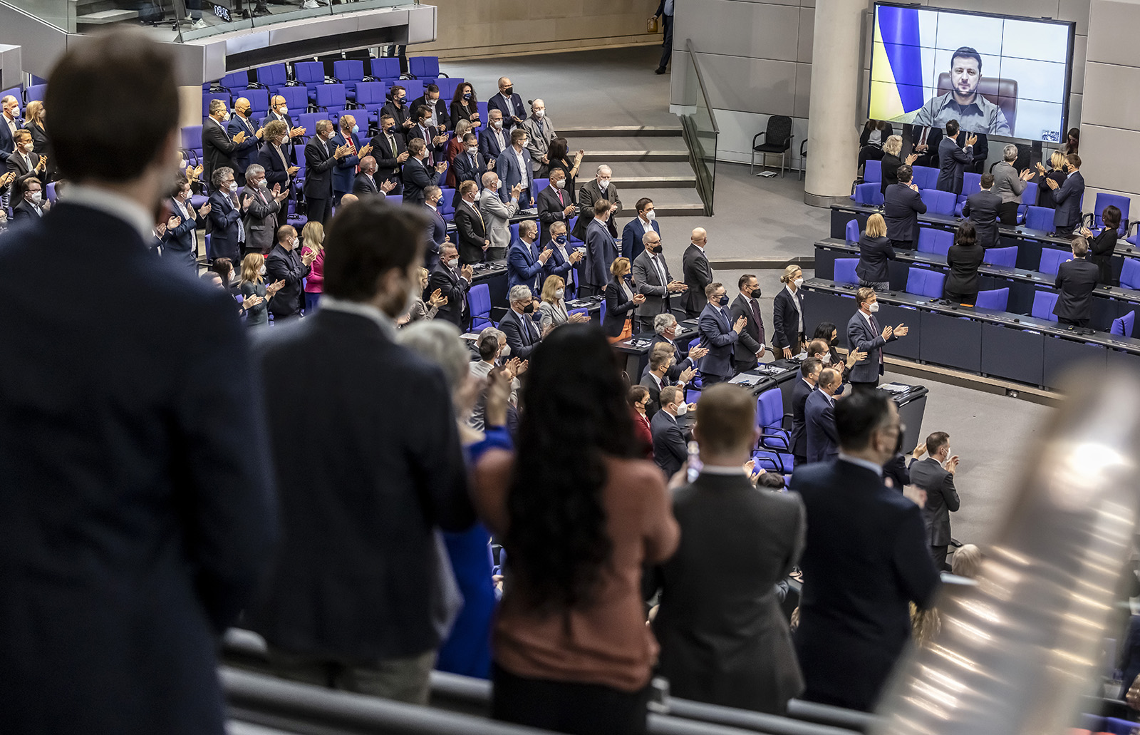 Ukrainian President Volodymyr Zelensky receives standing ovations before he addresses the German Bundestag via live video on March 17 in Berlin, Germany.