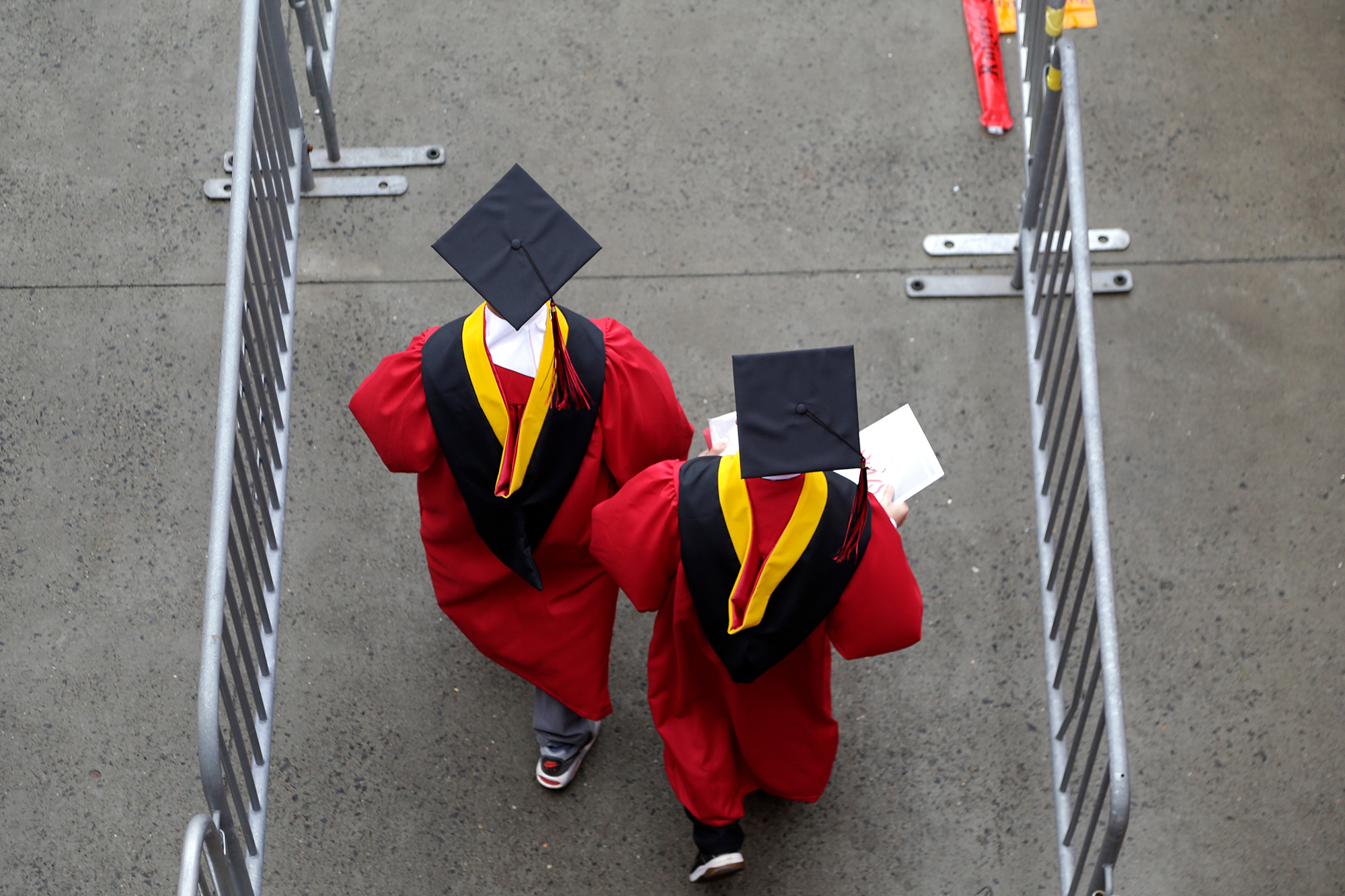 New graduates walk into the High Point Solutions Stadium before the start of the Rutgers University graduation ceremony in Piscataway Township, N.J., on May 13, 2018.