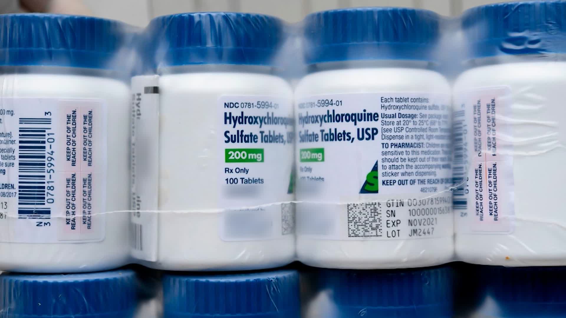 A Salvadoran Health Ministry worker shows a package of bottles of HydroxyChloroquine pills to be distributed in hospitals in San Salvador on April 21 amid the coronavirus outbreak.