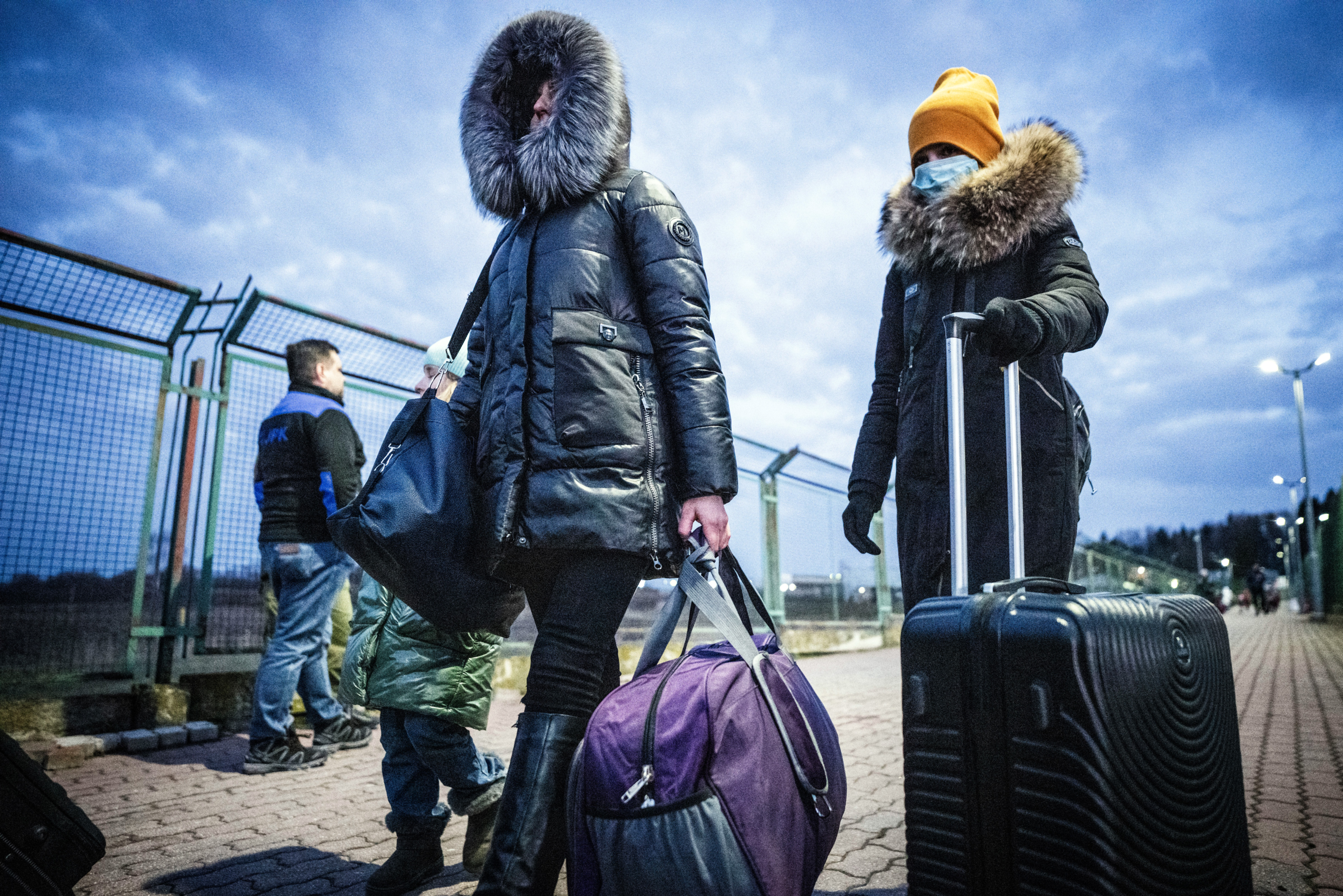 Refugees from Ukraine arrive in Medyka, Poland, after crossing the border from Shehyni in Ukraine on February 25.