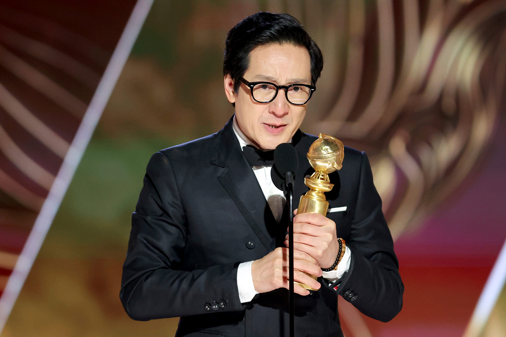 Ke Huy Quan accepts his best supporting actor in a motion picture award for "Everything Everywhere All at Once" on Tuesday, January 10.