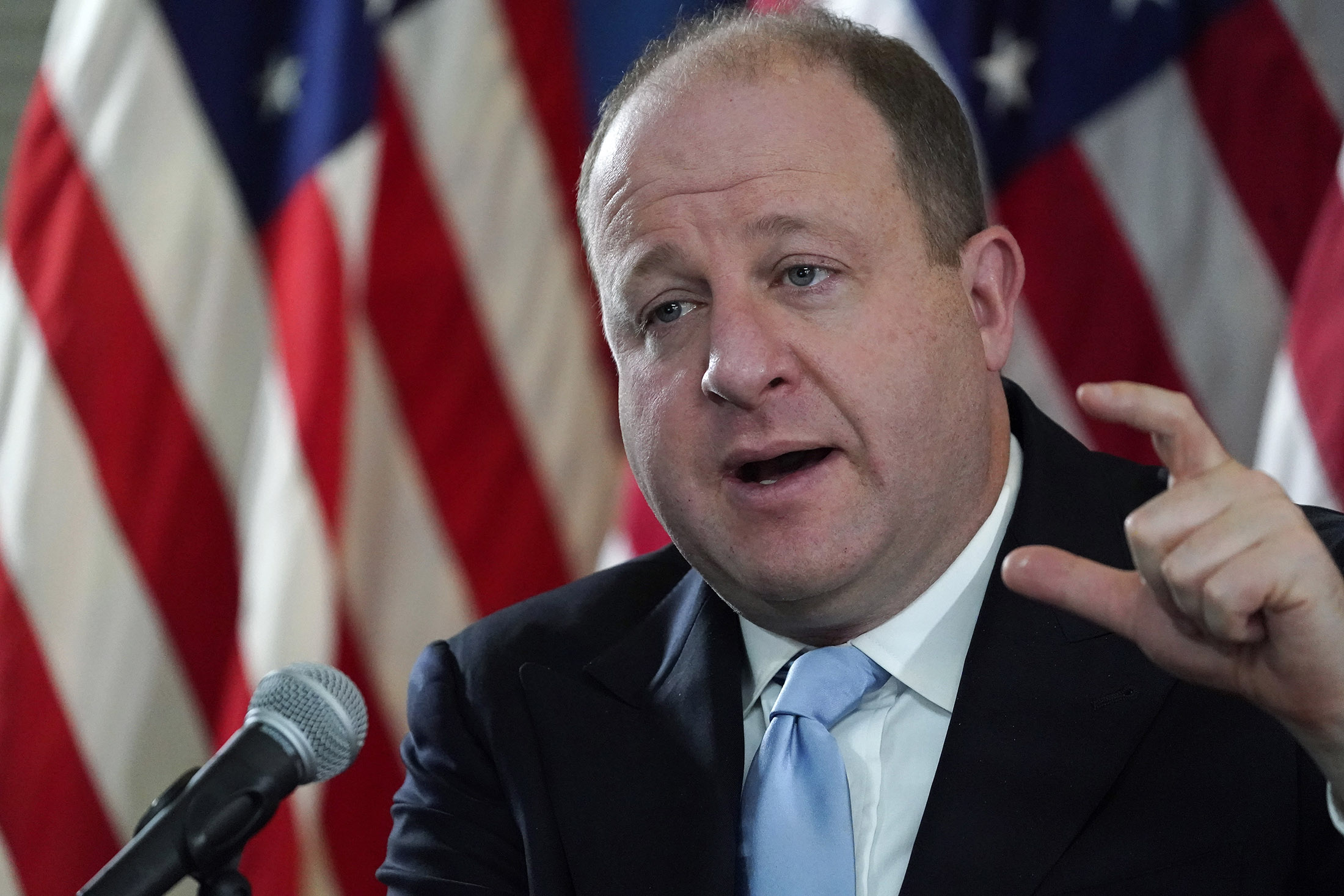 Colorado Gov. Jared Polis speaks during a news conference about the state's response to the rapid increase in Covid-19 cases, on Tuesday, November 24, in Denver. 