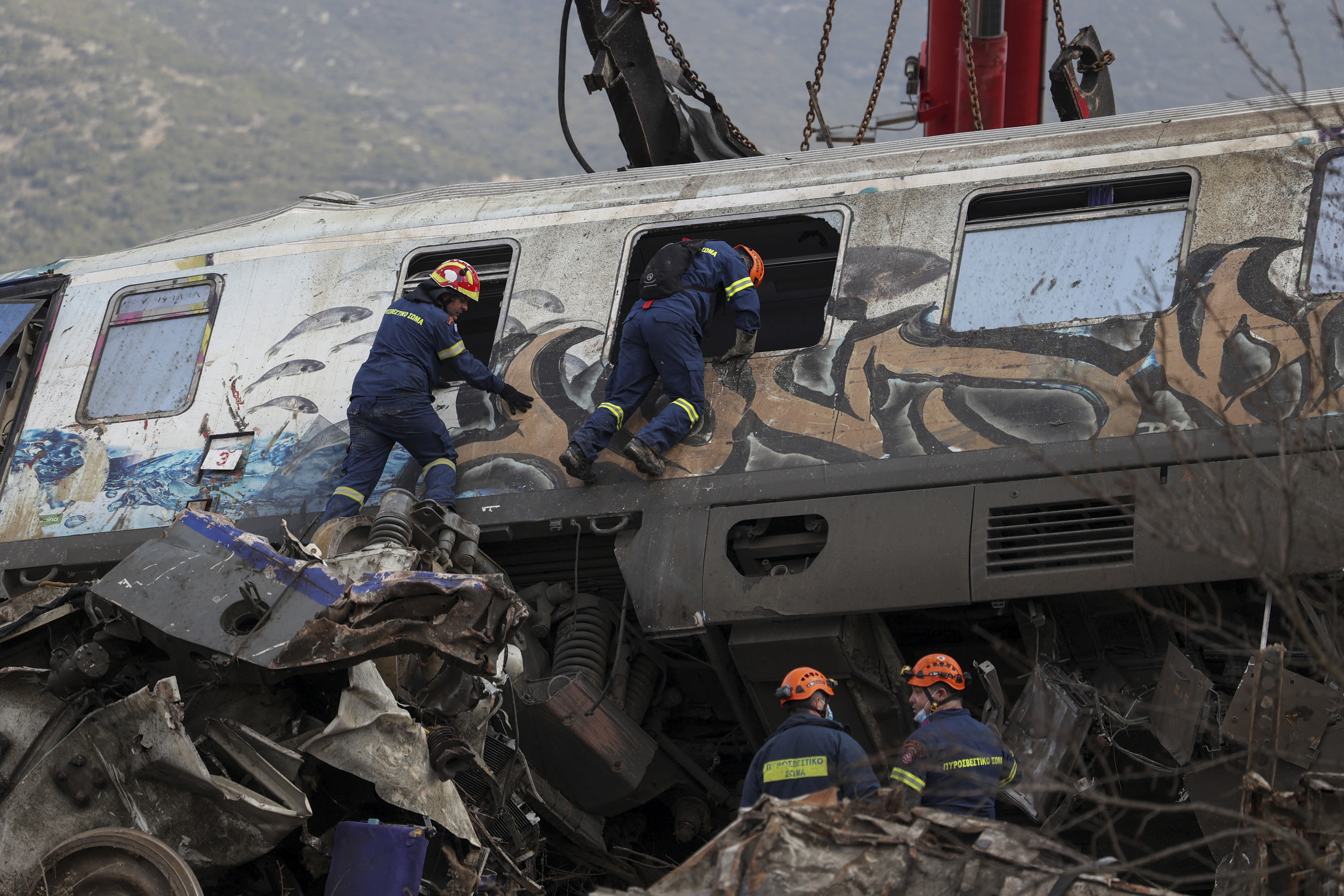 Rescuers operate at the site of a crash. 