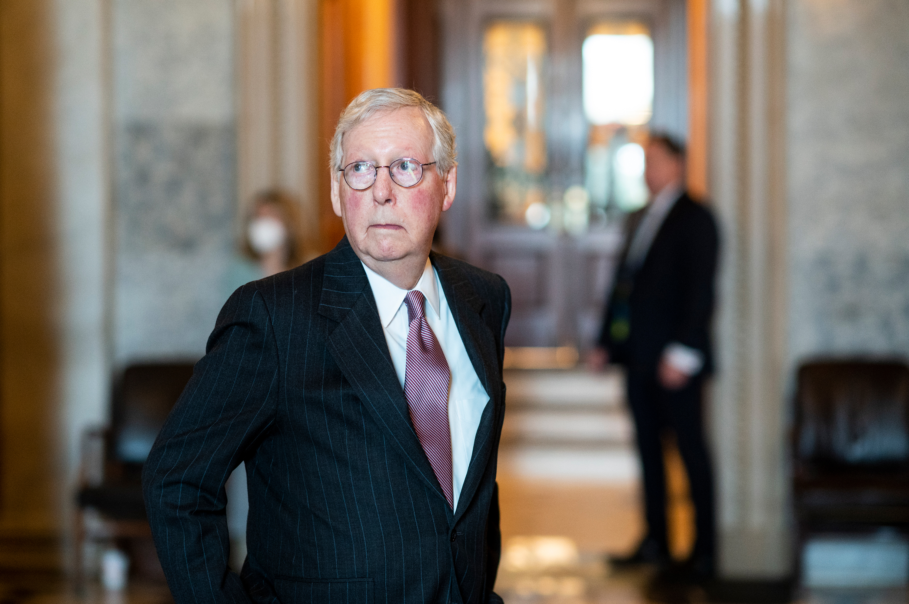 Senate Minority Leader Mitch McConnell walks in the halls of the Capitol on February 17. 