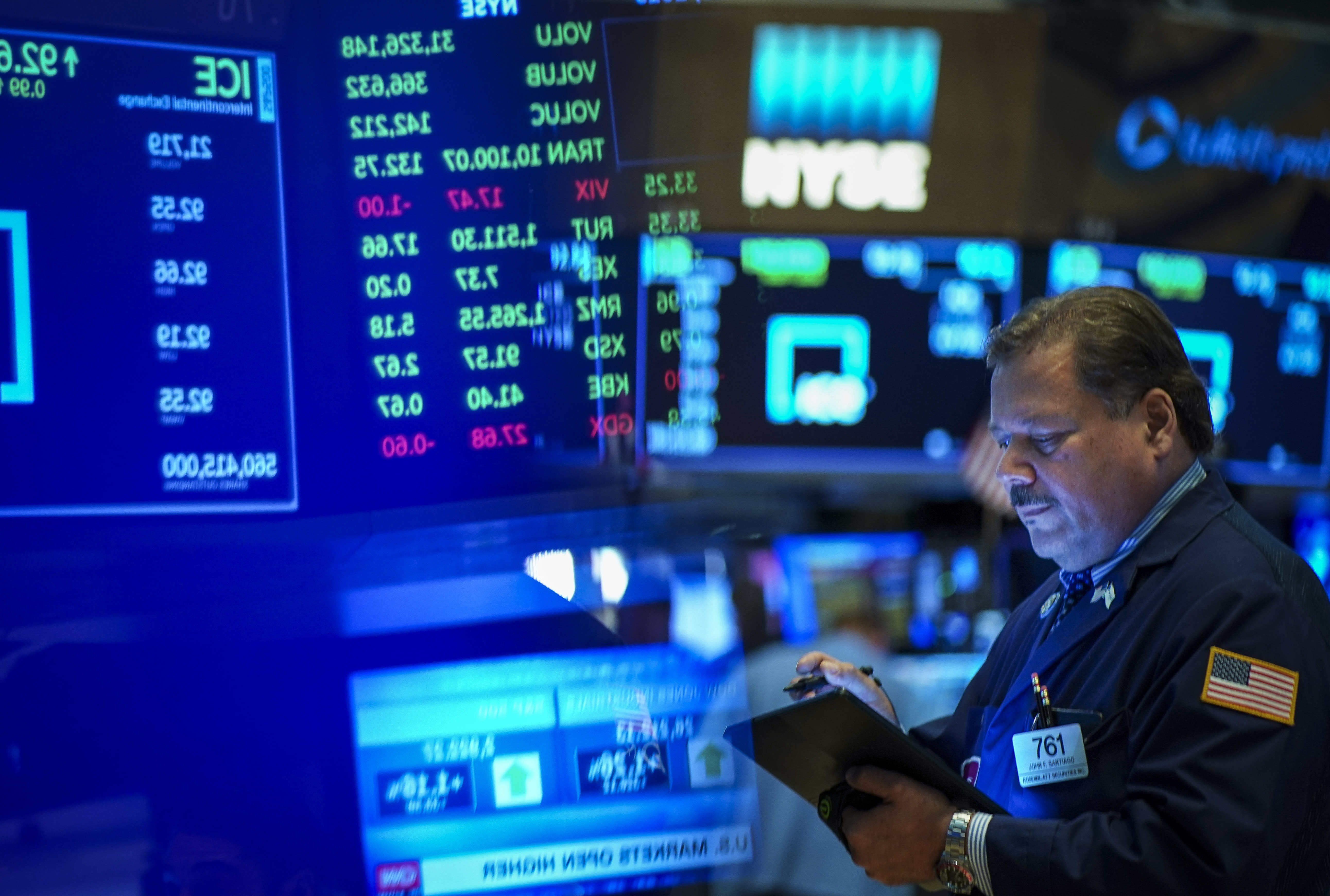 Traders and financial professionals work on the floor of the New York Stock Exchange (NYSE) at the opening bell on Aug. 19, 2019 in New York City.  