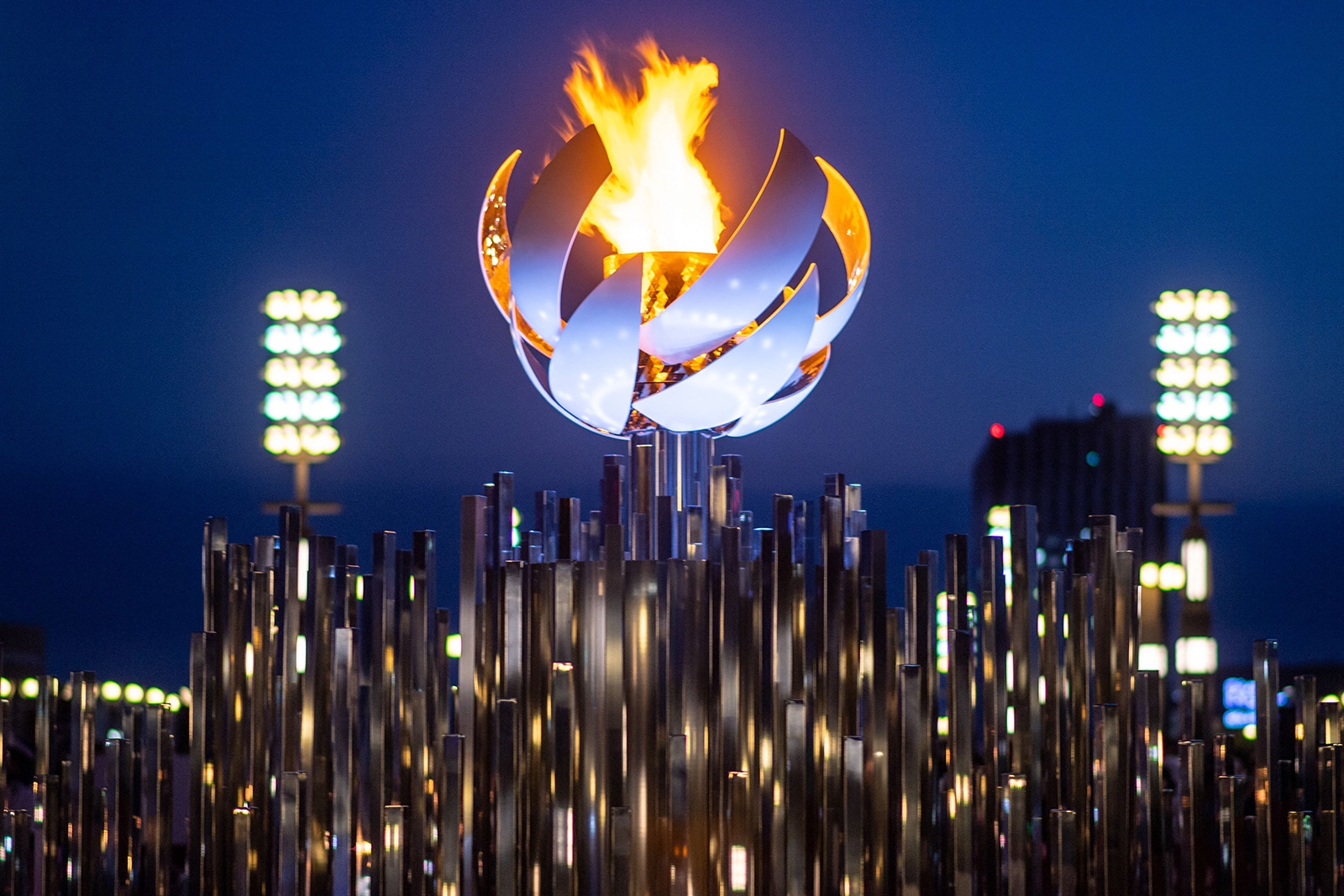 The Olympic flame is seen burning on the cauldron at Ariake Yume-no-Ohashi Bridge in Tokyo on July 25.