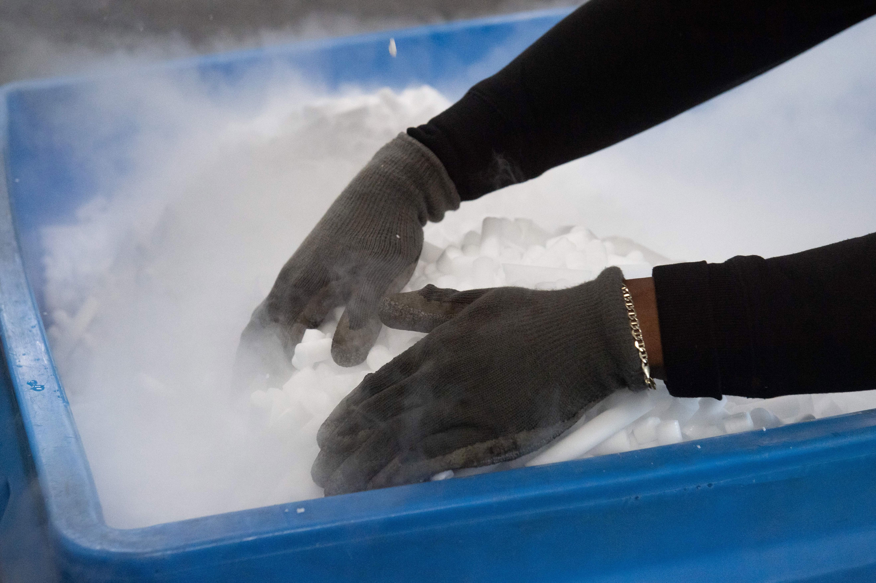 An employee makes dry ice pellets at Capitol Carbonic, a dry ice factory contacted by Pfizer for its Covid-19 vaccine, in Baltimore, Maryland on Nov. 20.