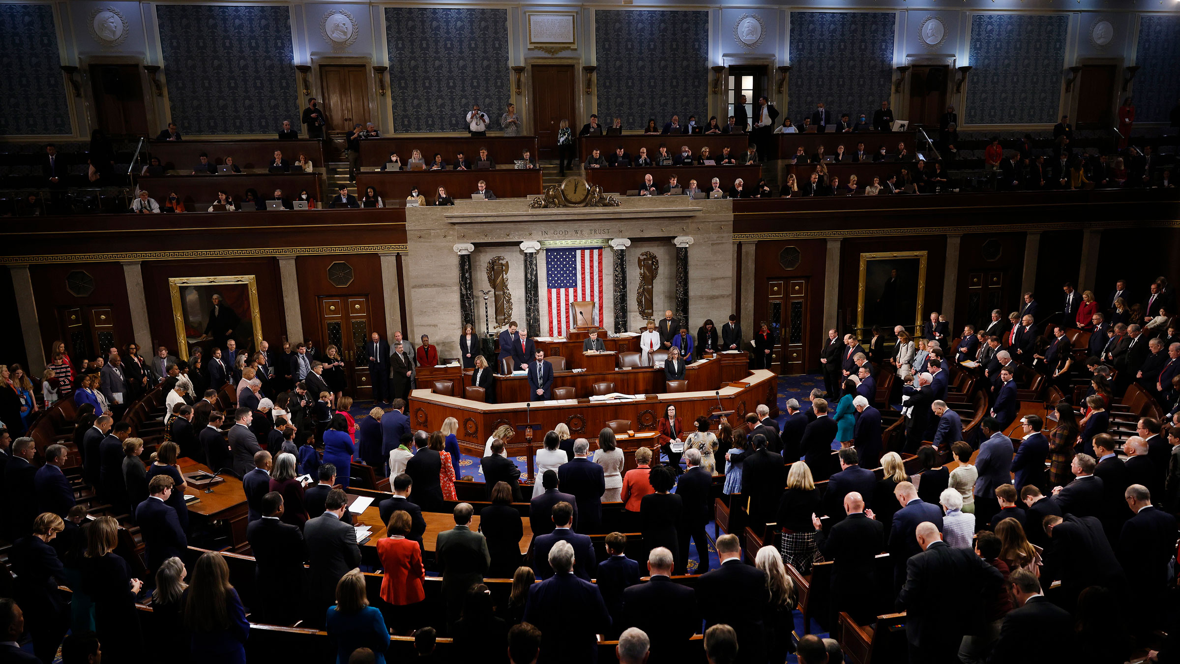 Members of the 118th Congress stand for the Pledge of Allegiance on Tuesday.