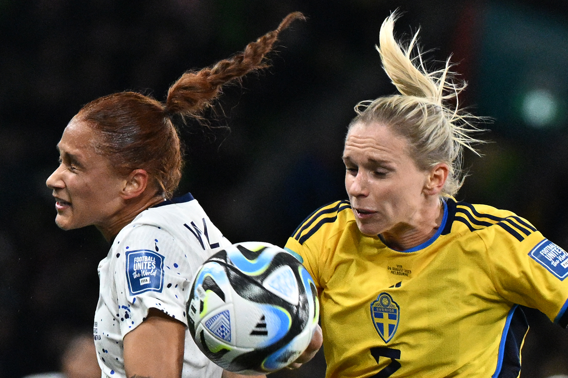 US forward Lynn Williams, left, and Sweden defender Jonna Andersson, right, fight for the ball.