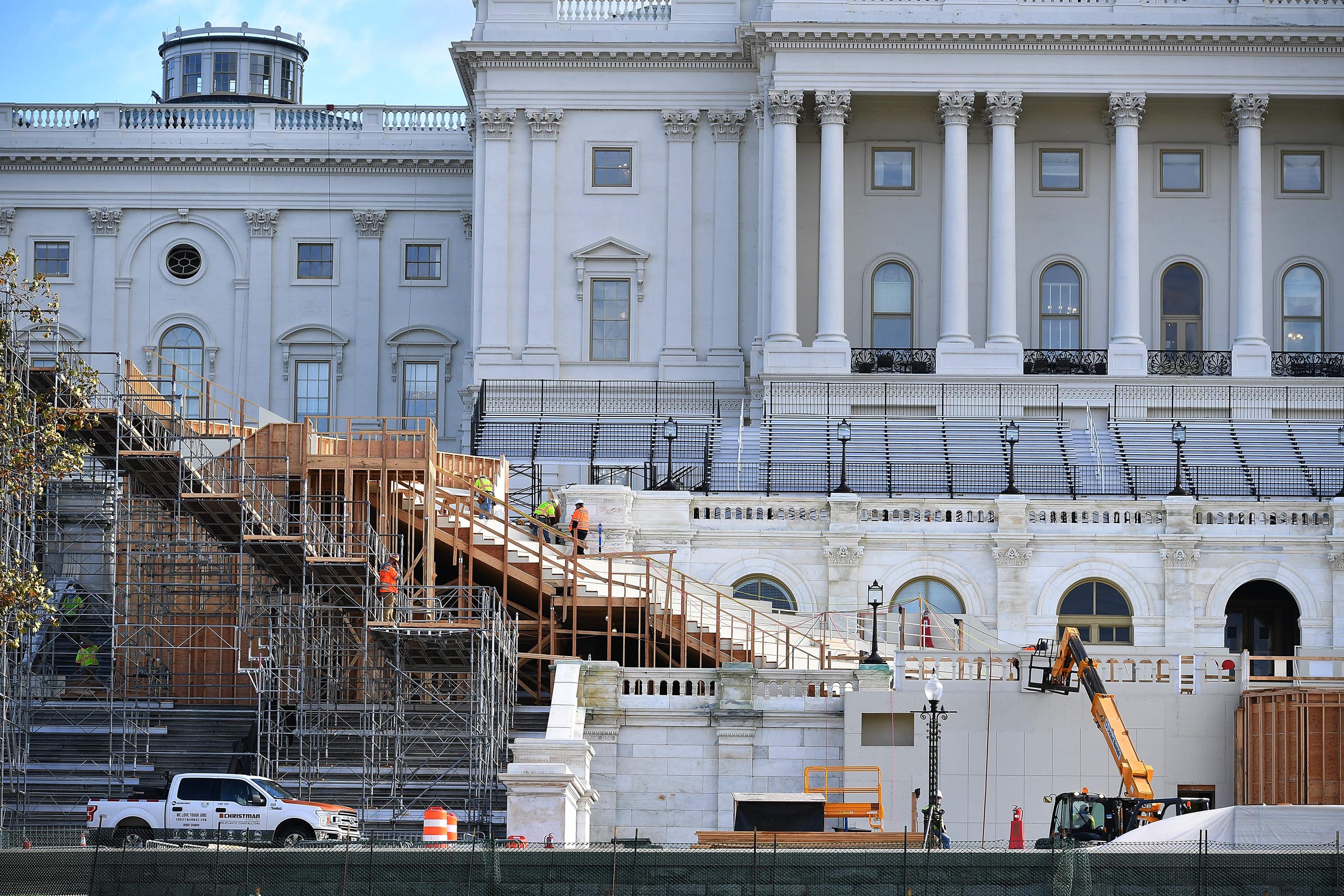 Workers construct the stage for the presidential inauguration at the US Capitol in Washington, DC, on December 1, 2020.