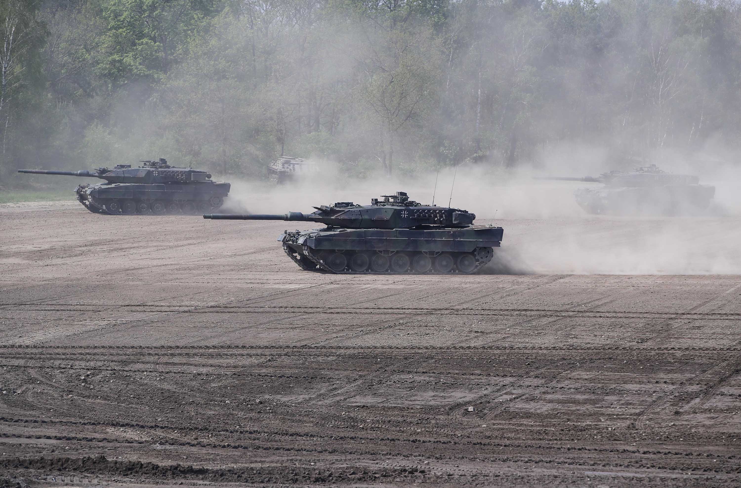 A file image shows Leopard 2 tanks in action during a training demonstration in Munster, Germany, in May 2019.
