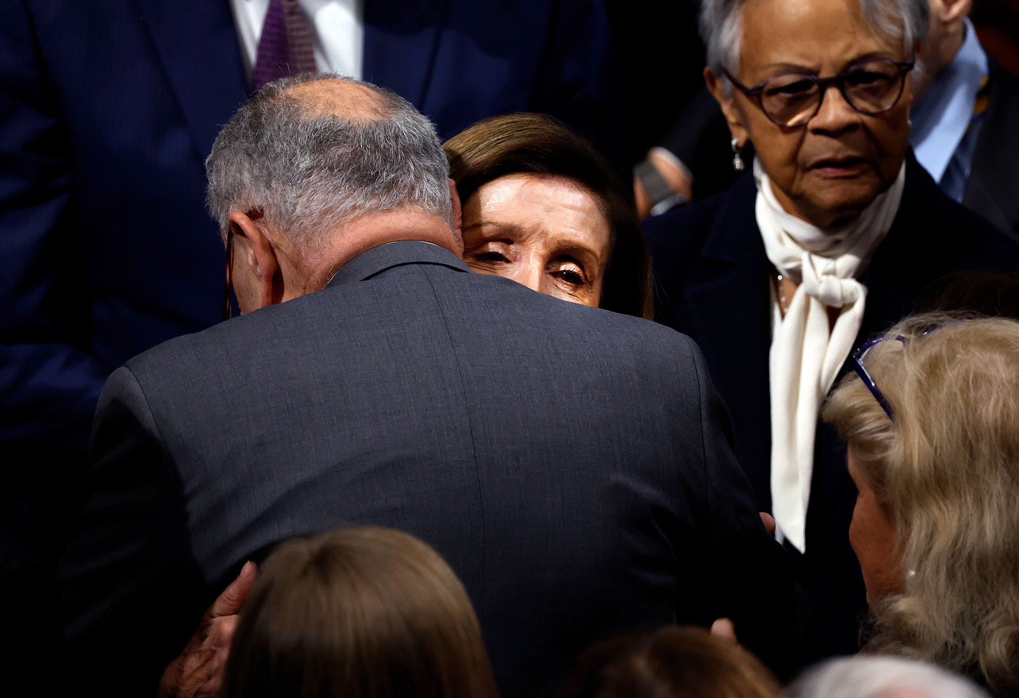 House Speaker Nancy Pelosi hugs Senate Majority Leader Chuck Schumer after she delivered remarks from the House Chambers on November 17. 
