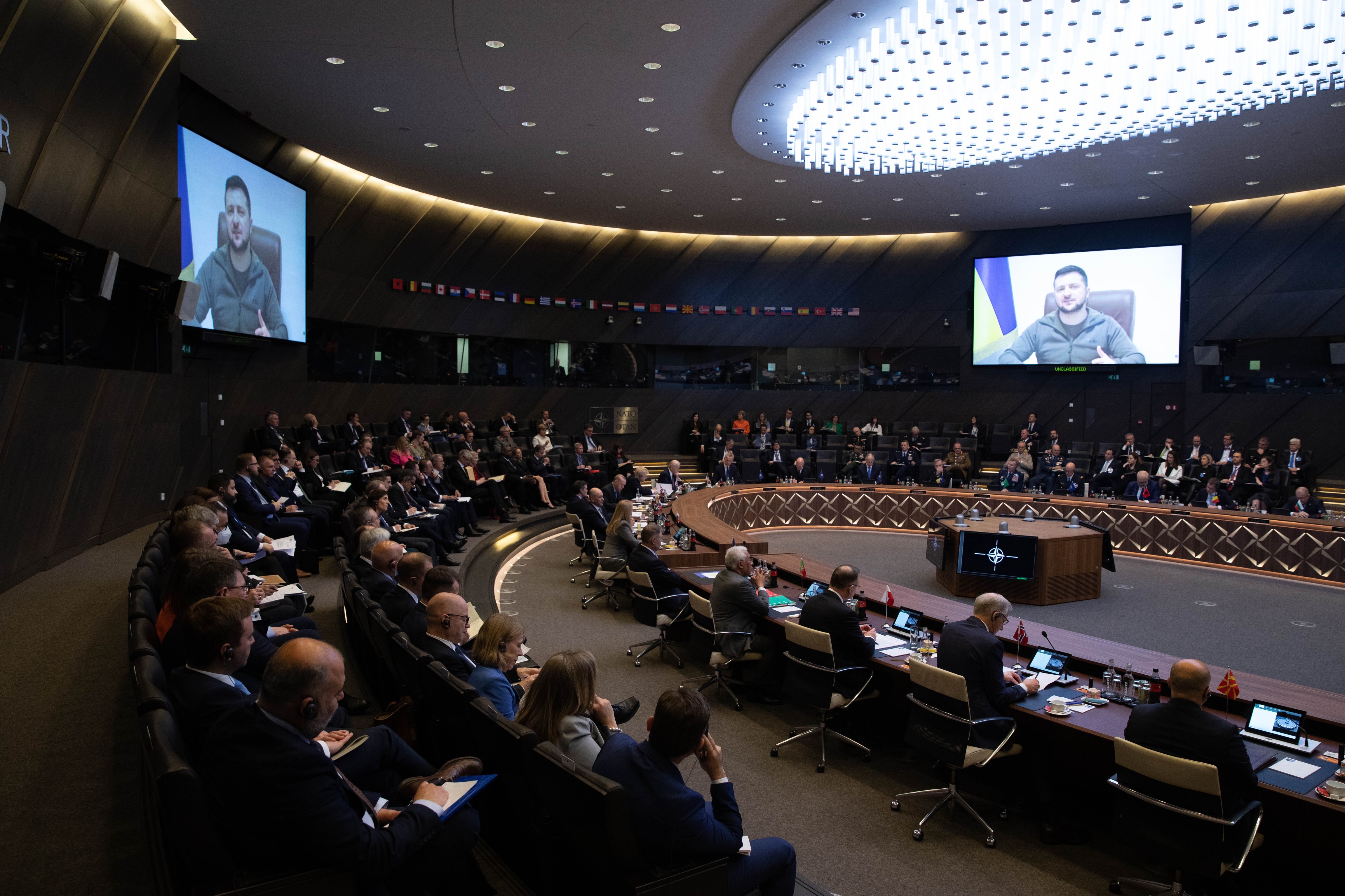 Ukrainian President Volodymyr Zelensky addresses via video link a meeting of the Extraordinary Summit of NATO Heads of State and Government held in Brussels, Belgium, on March 24.