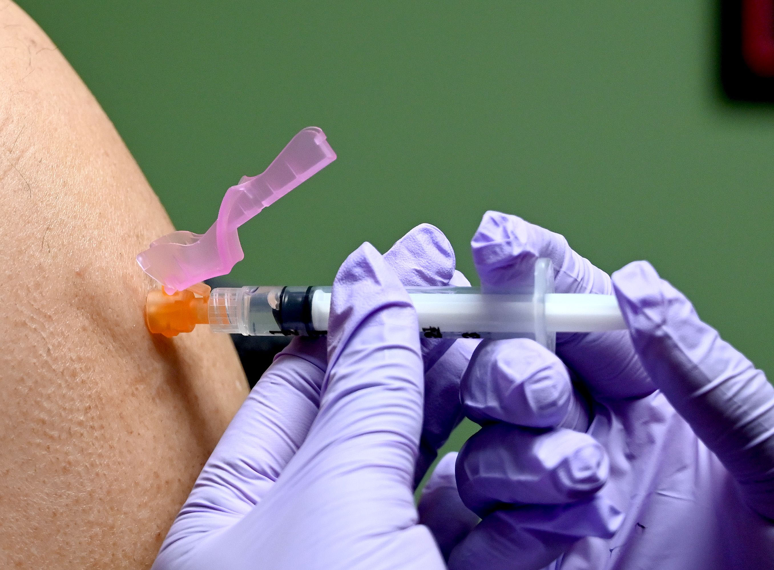 A person gets a flu shot at a health facility in Washington, DC, on January 31.
