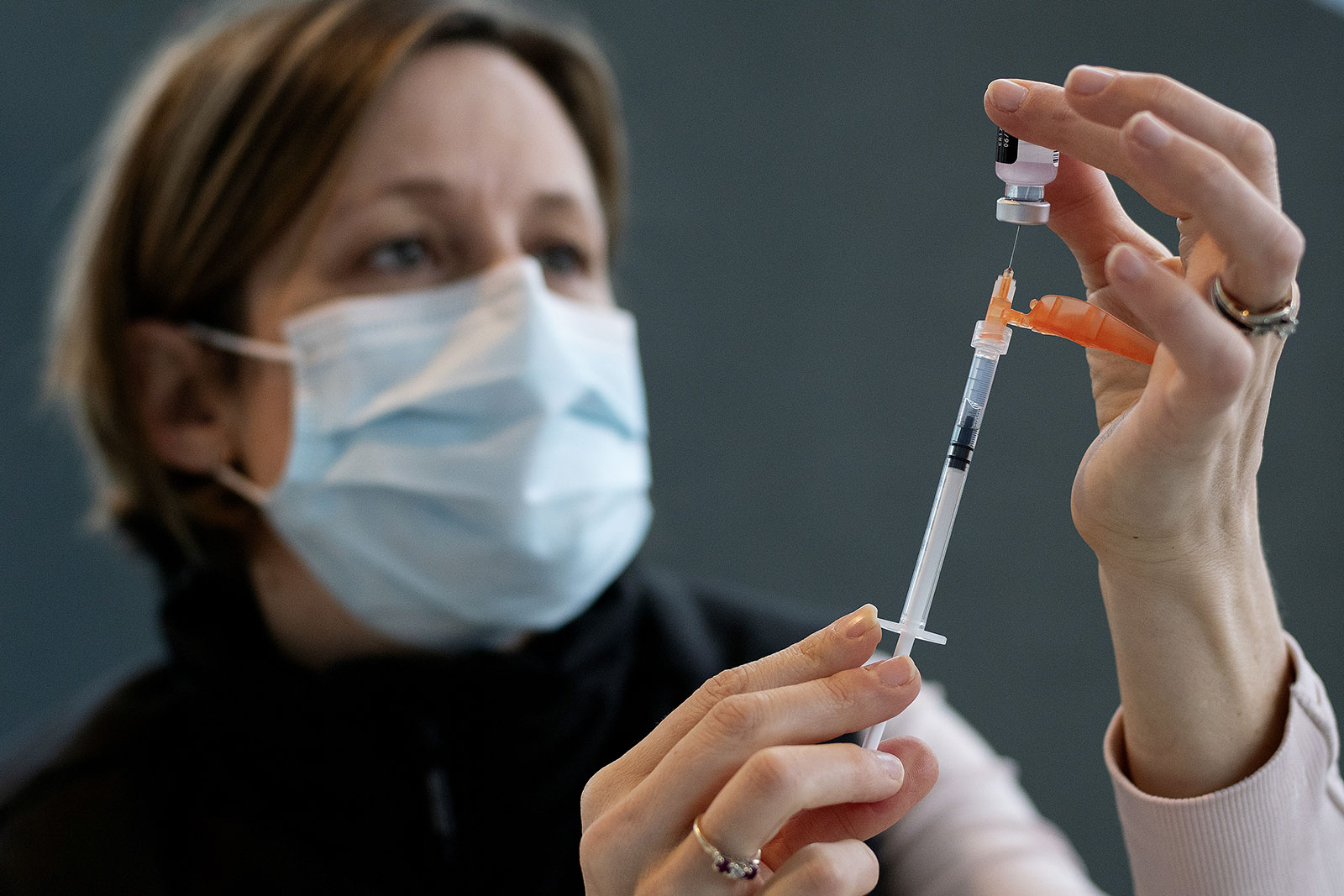 A healthcare worker fills a syringe with the Pfizer-BioNTech Covid-19 vaccine at a vaccination clinic in Vancouver, Canada, on Thursday, March 4. Canada announced Wednesday that it has approved the Pfizer-BioNTech Covid-19 vaccine for children ages 12 to 15.