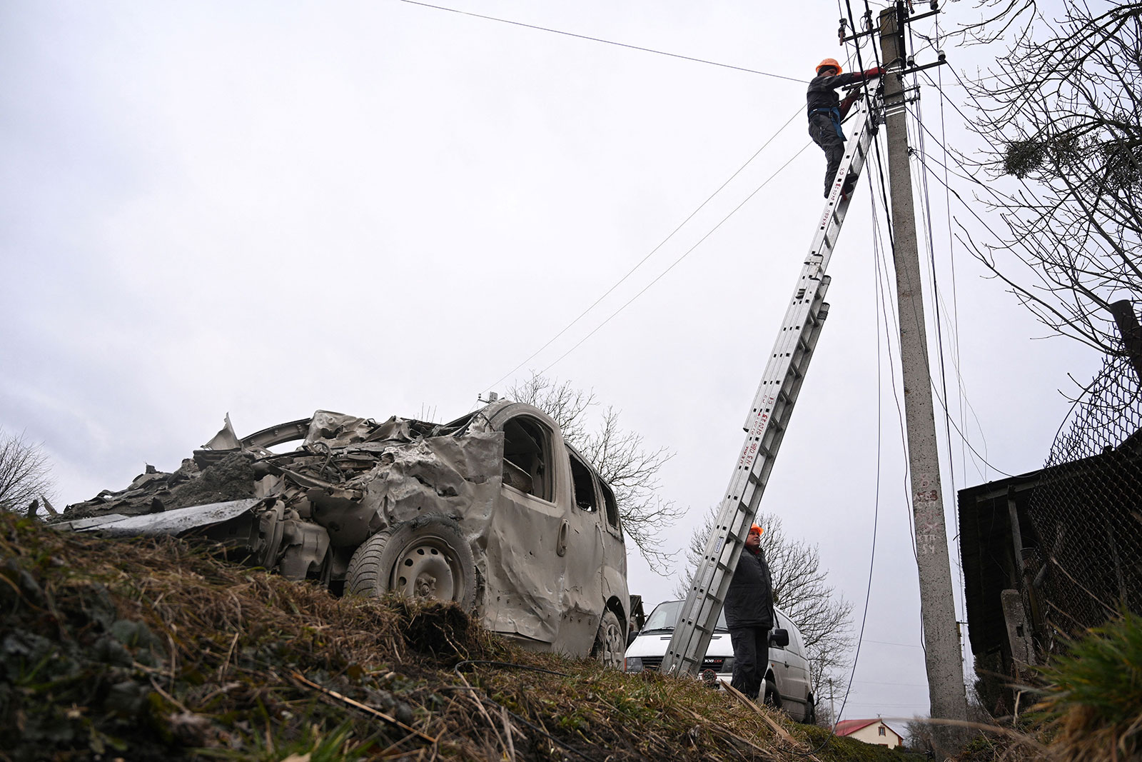 A worker repairs a power line following a Russian strike in the village of Velyka Vilshanytsia, Lviv region, Ukraine, on March 9. 