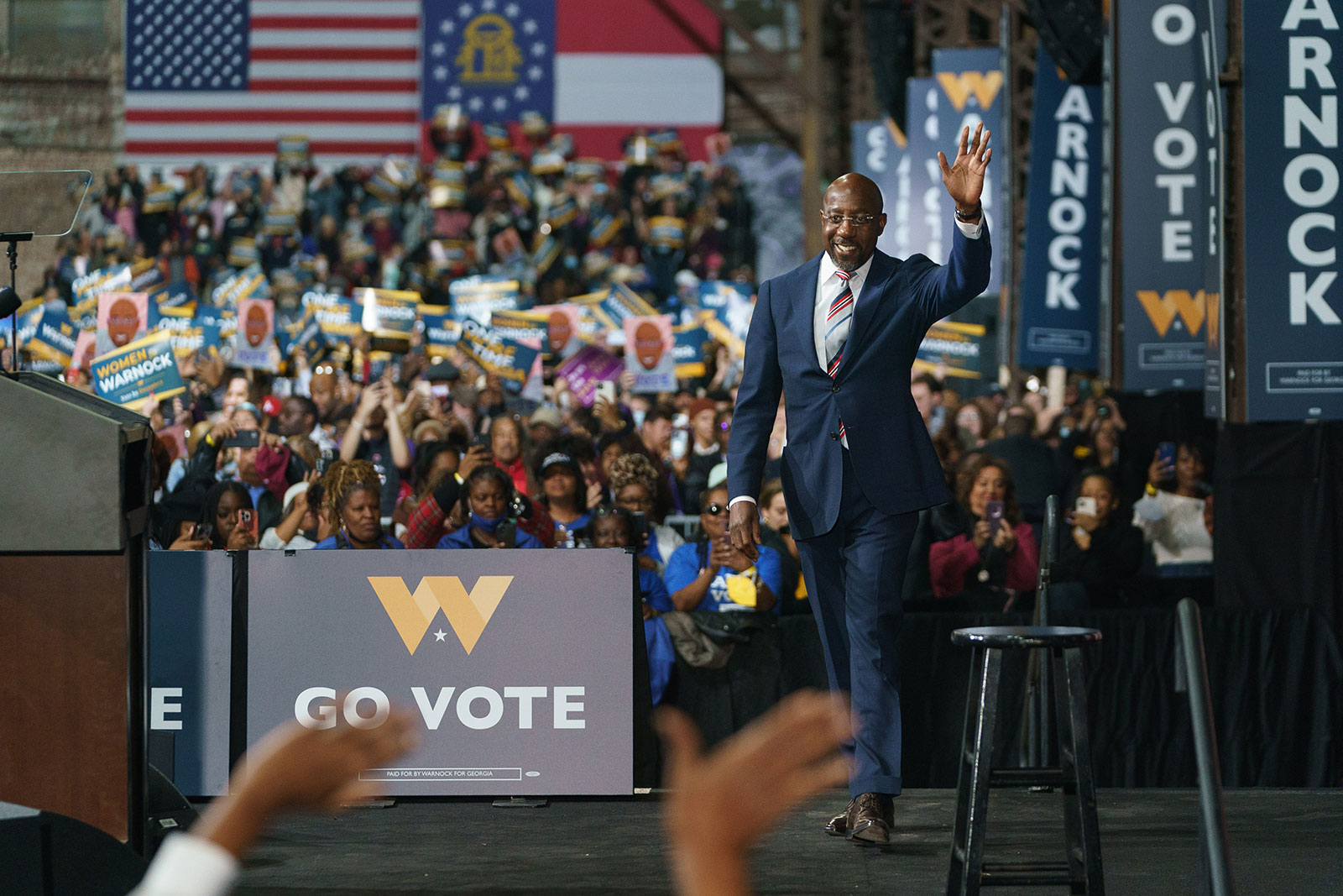 Sen. Raphael Warnock walks on stage during a campaign rally in Atlanta on December 1. 