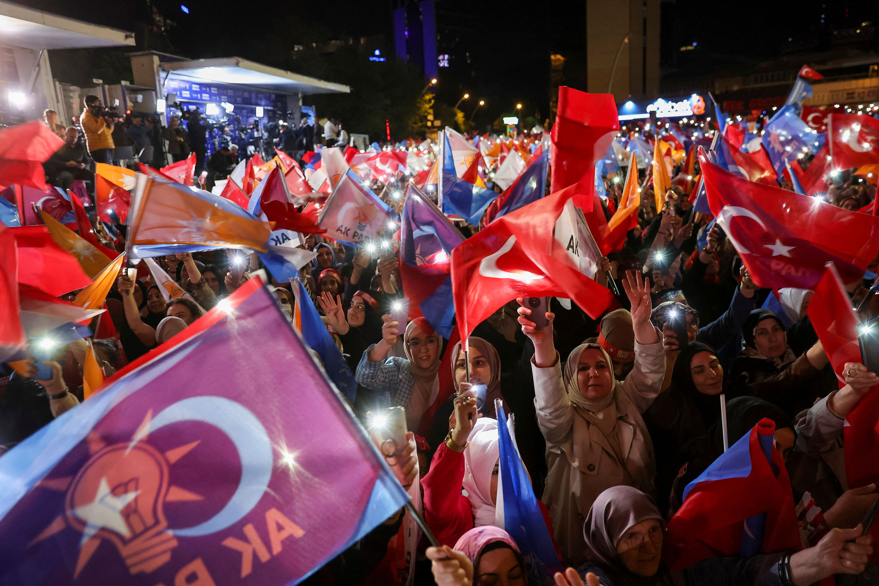 Supporters of Turkish President Tayyip Erdogan wave flags outside the AK Party headquarters in Ankara, Turkey, on May 15. 