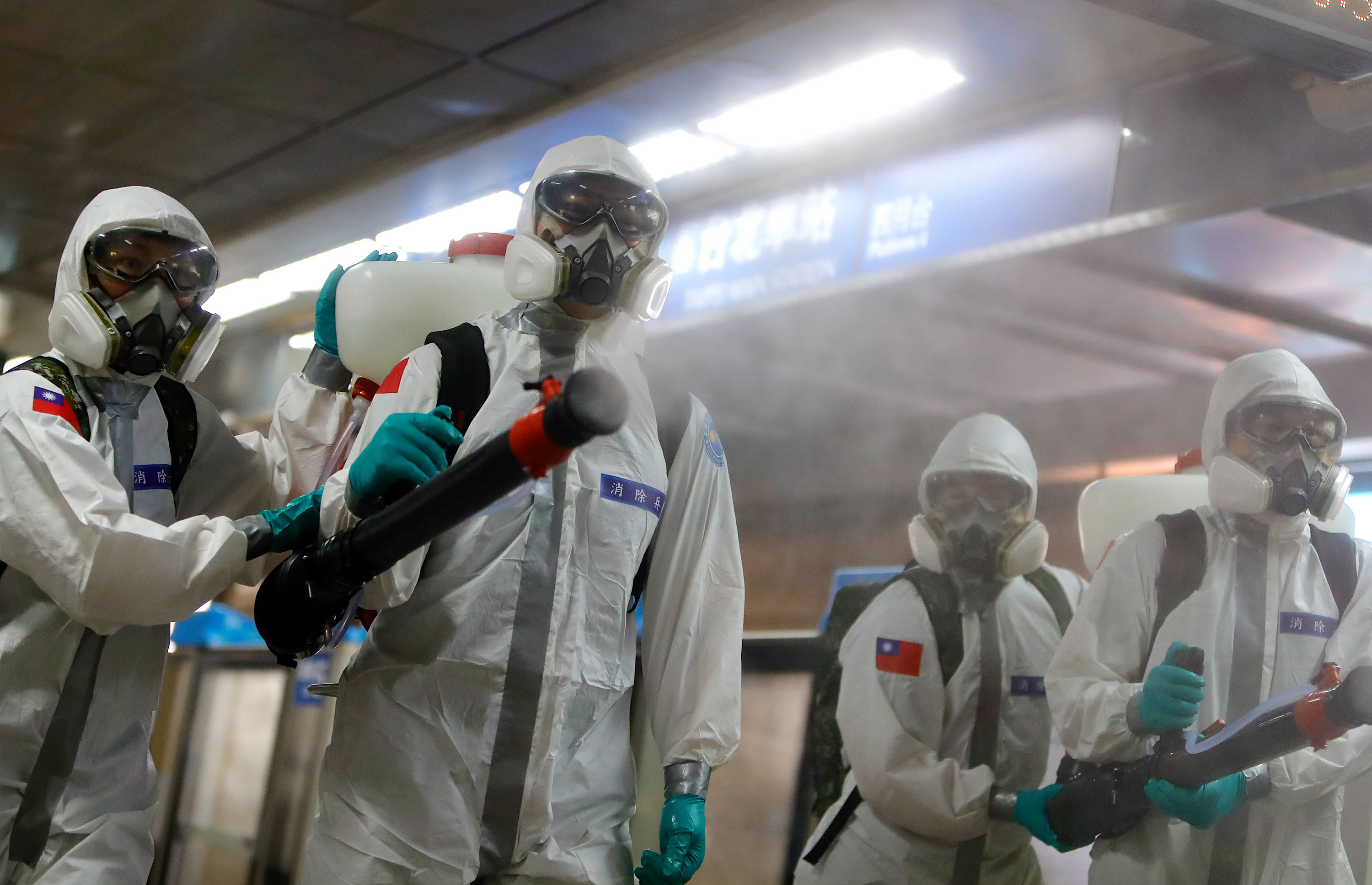 Military officers disinfect a subway station in Taipei, Taiwan on Tuesday, May 18. 