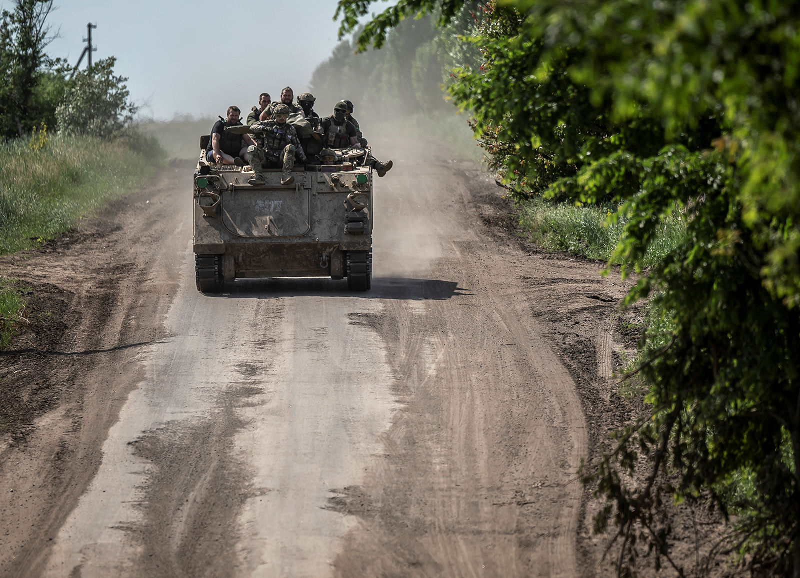 Ukrainian service members ride an armored personnel carrier near Bakhmut, Ukraine, on June 9. 