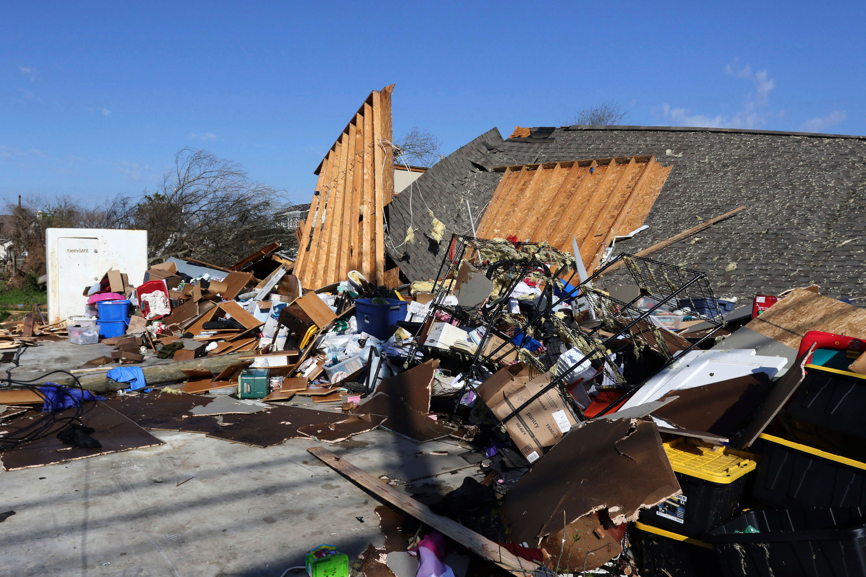 The remains of a recreational vehicle garage and the safe room is damaged in Amory, Mississippi, on March 25. 