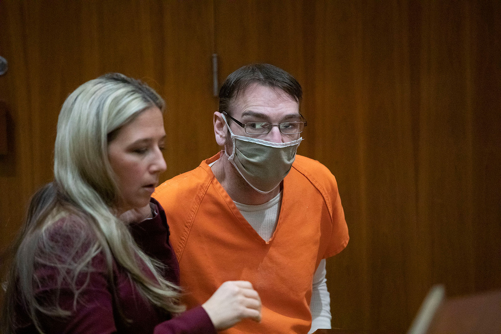 James Crumbley, right, speaks with his defense attorney Mariell Lehman during a pretrial hearing on March 22, 2022, in Pontiac, Michigan. 