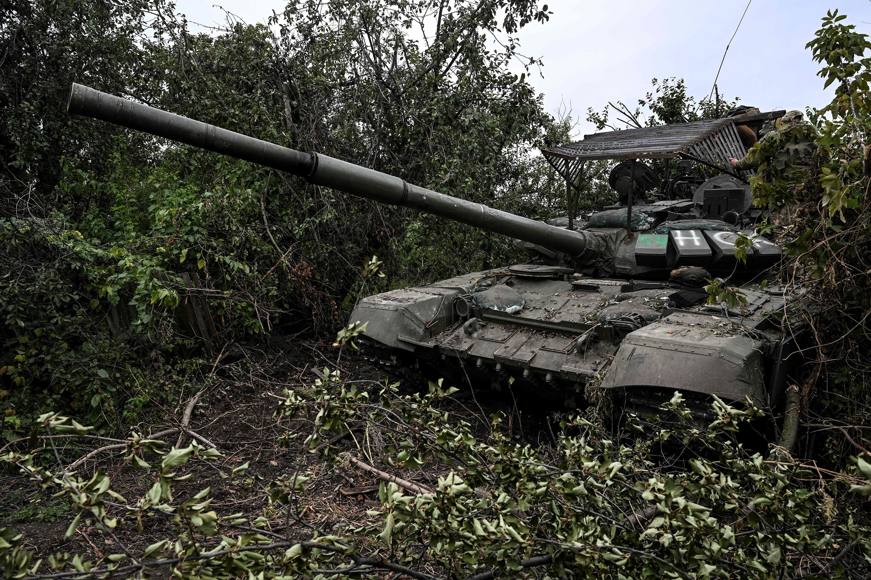 An abandoned Russian tank is seen in a village on the outskirts of Izyum in the Kharkiv region of Ukraine on September 11.