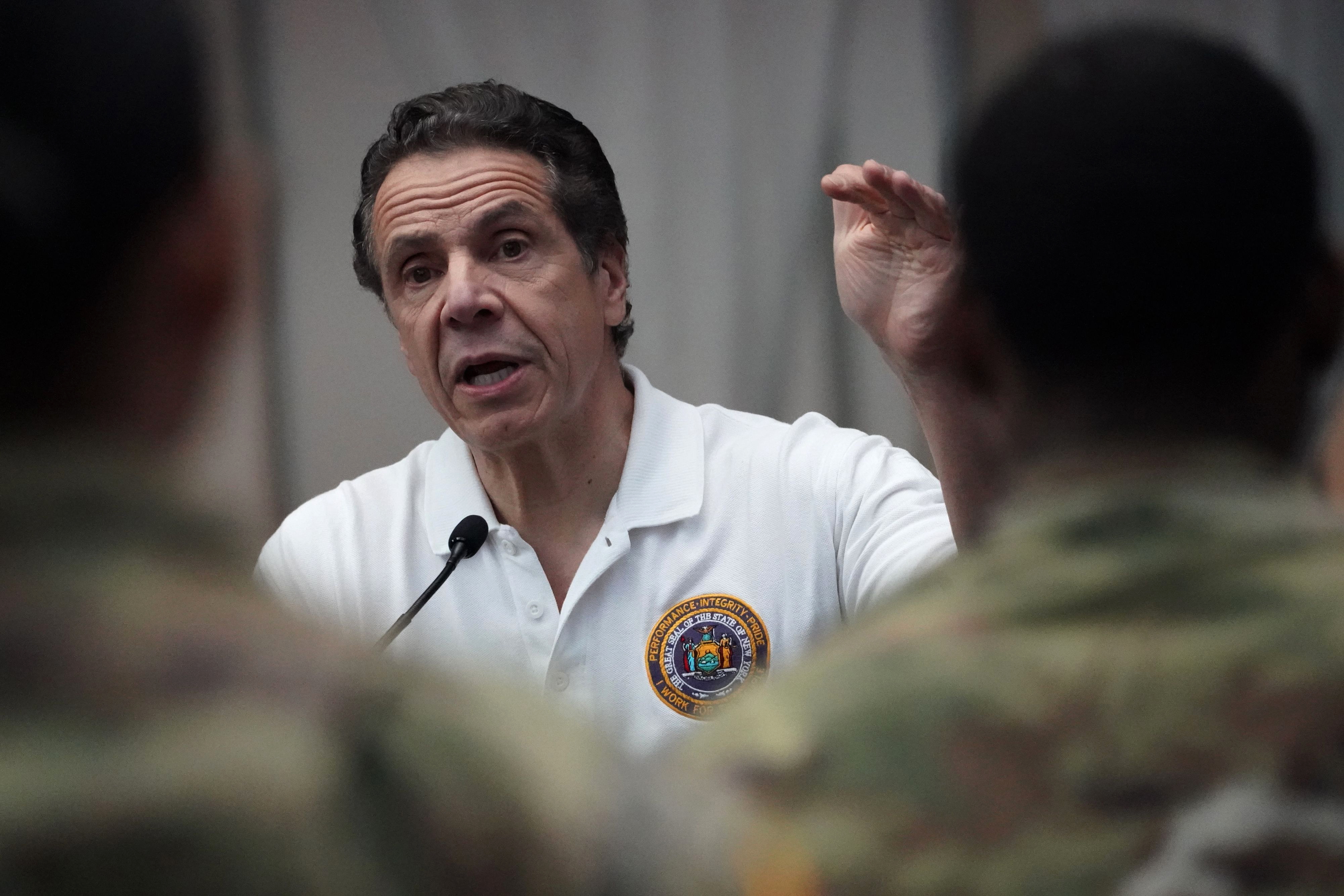 National Guard troops listen as New York Gov. Andrew Cuomo speaks at the Javits Center in New York City on March 27.