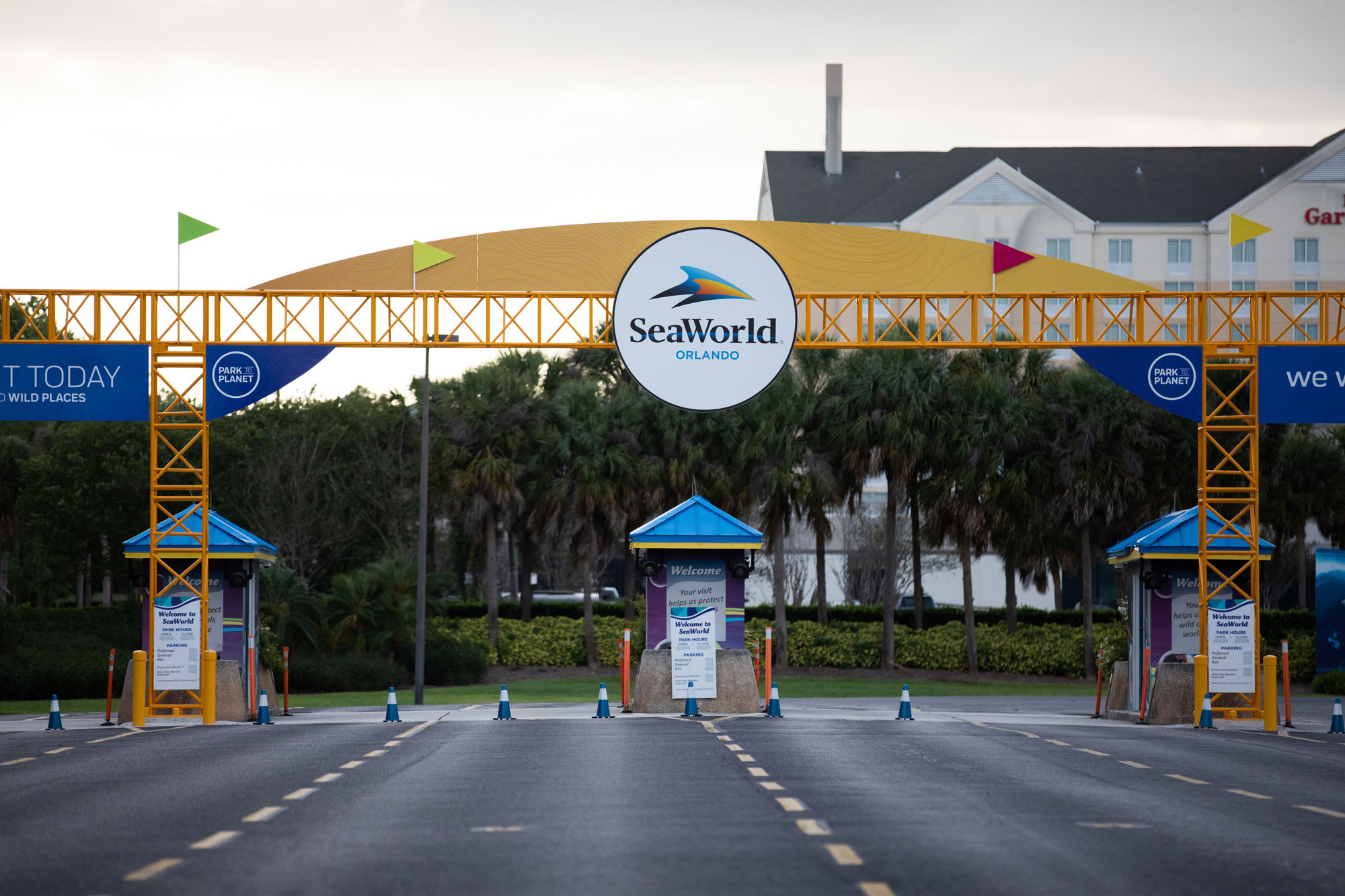 Traffic cones block the entrance to the SeaWorld amusement park temporarily closed in Orlando on May 15.