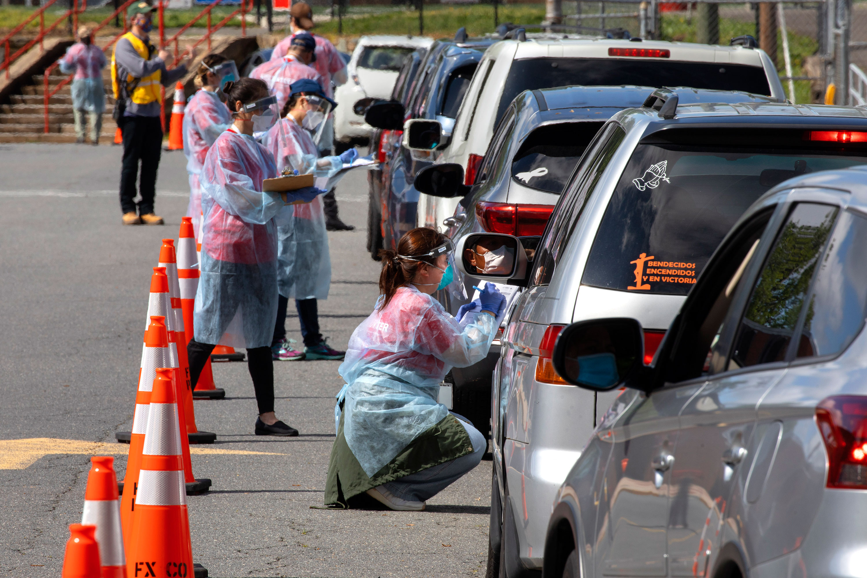 People wait in line to be tested for coronavirus on May 23 in Annandale, Virginia.
