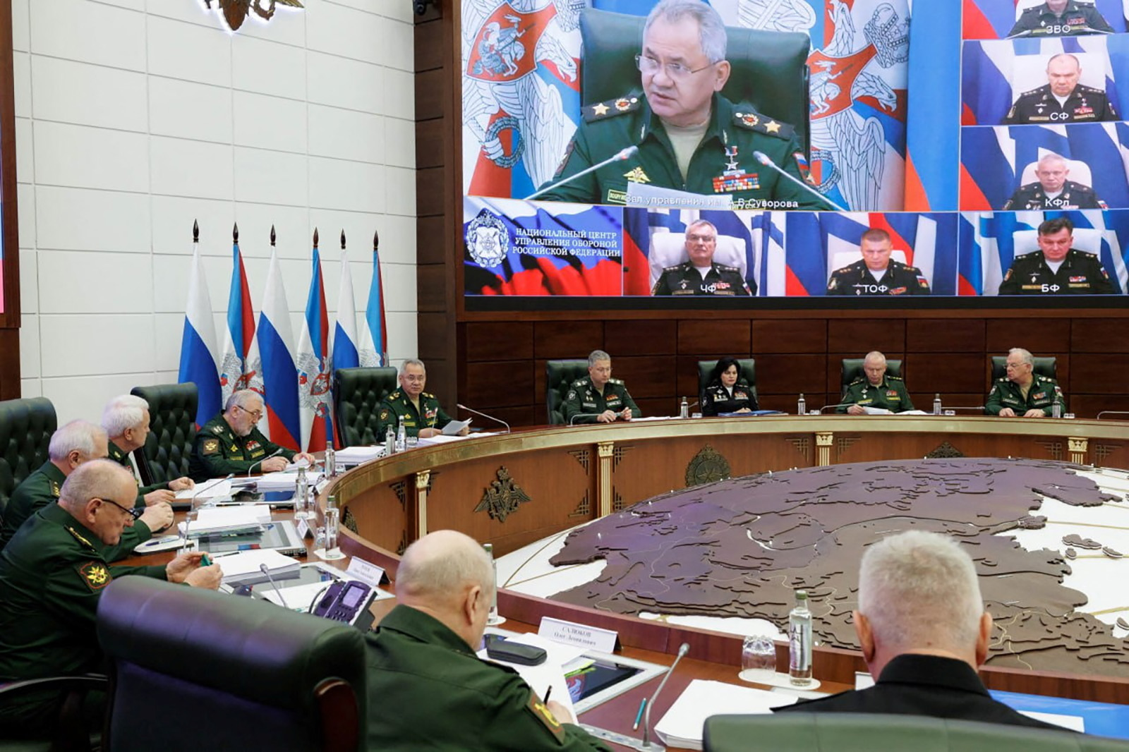 Russian Defence Minister Sergei Shoigu chairs a meeting with the leadership of the Armed Forces, Admiral Viktor Sokolov is bottom left on screen, in Moscow, Russia, in this picture released September 26.