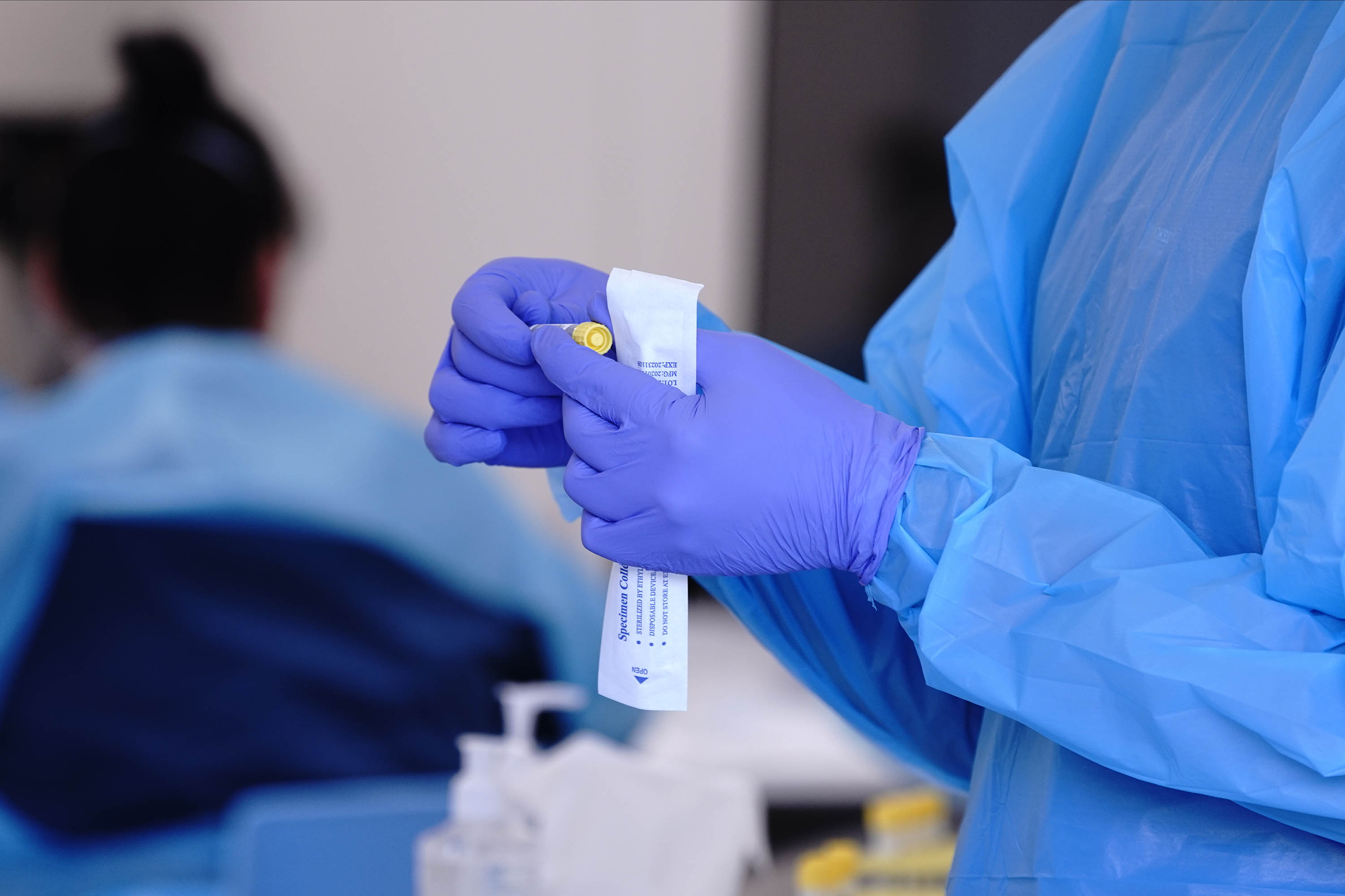 A health care worker prepares a vial for a swab sample at a Covid-19 test site in San Marcos, California, on January 2. San Diego County officials have confirmed that a virus variant first found in the UK has been detected in a patient there.